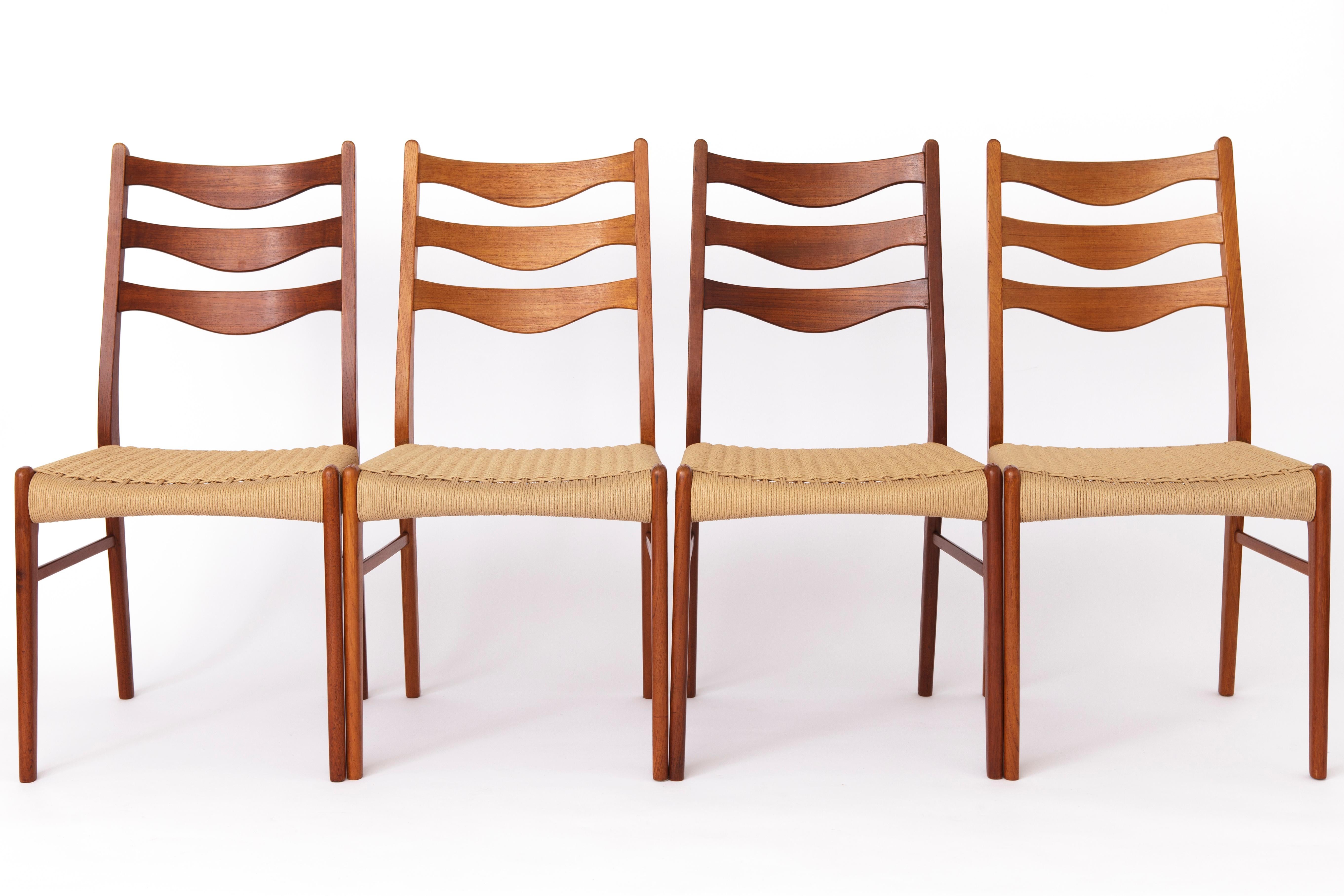 Teak 5 Arne Wahl Iversen Mid century teak dining chairs with papercord seat. For Sale