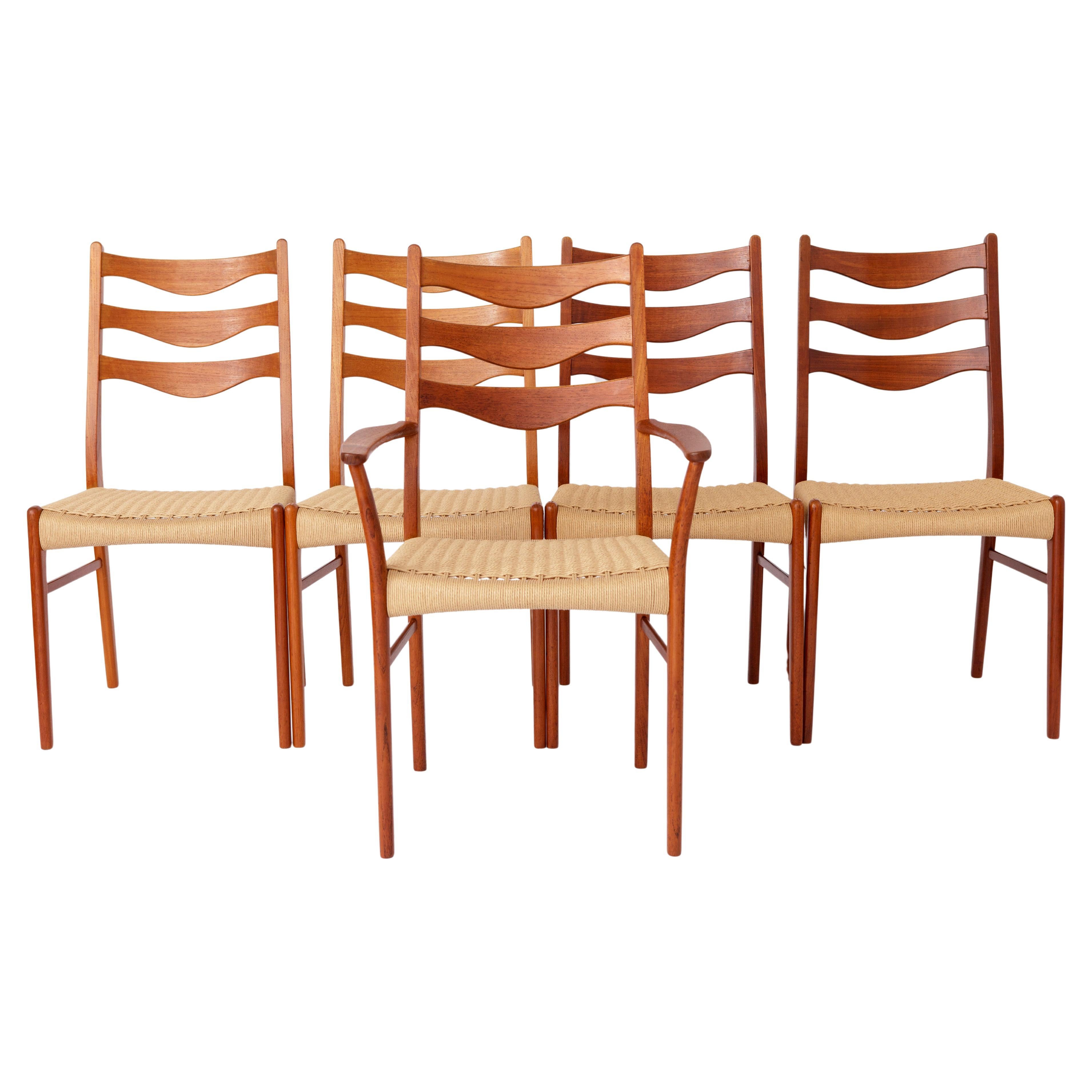 5 Arne Wahl Iversen Mid century teak dining chairs with papercord seat.