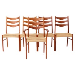 Retro 5 Arne Wahl Iversen Mid century teak dining chairs with papercord seat.