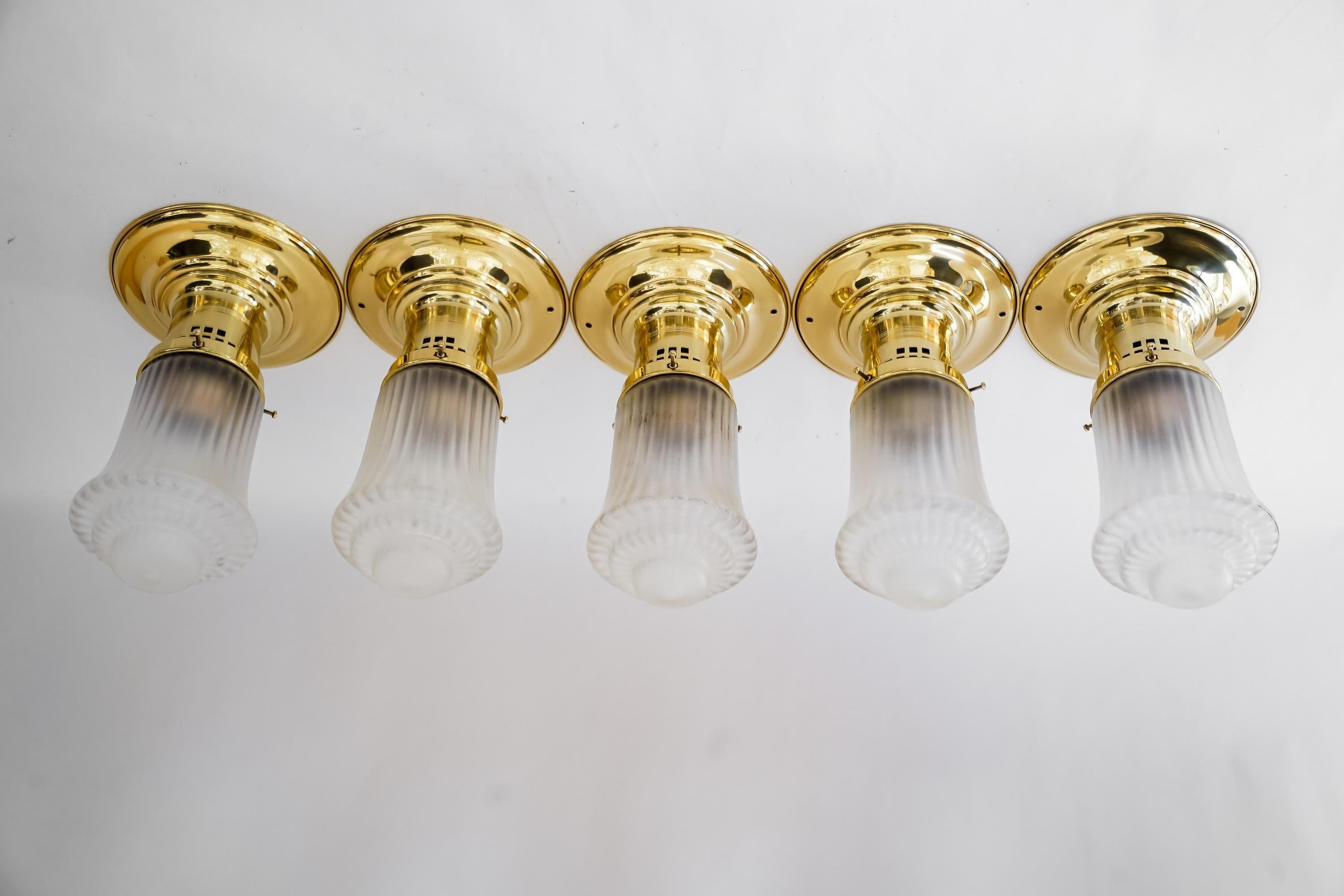 5 Art Deco ceiling lamps with original antique glass shades vienna around 1920s 
Polished and stove enameled
4 ceiling lamps has holes for mounting directly to the ceiling 
One has not the holes.
Price per piece.