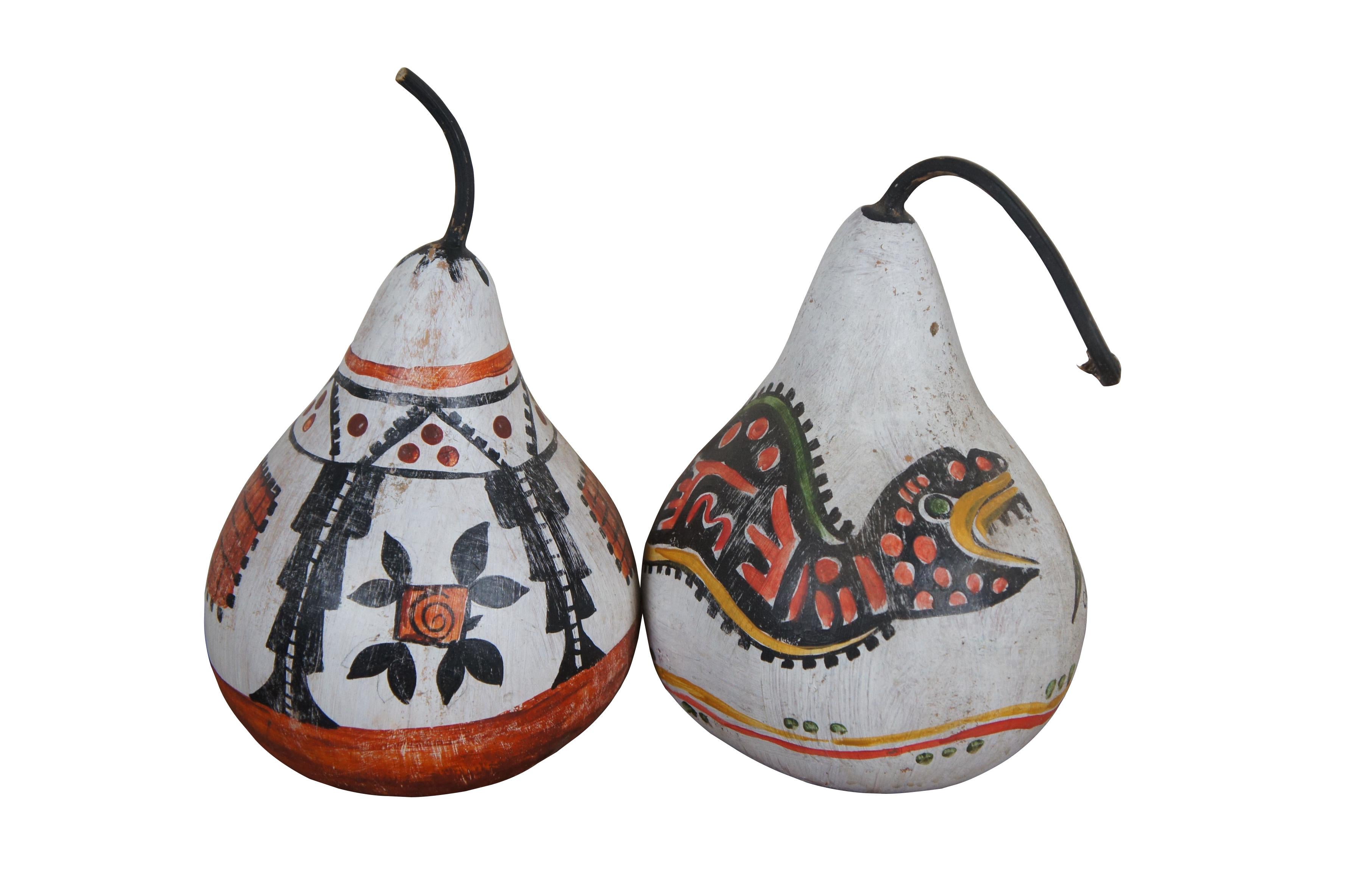 Lot of five late 20th century native Southwestern folk art hand painted gourds. Variety of colors and pattern motifs including a snake and a Pueblo Bird. Two signed CH 2011.

Dimensions:
6.5