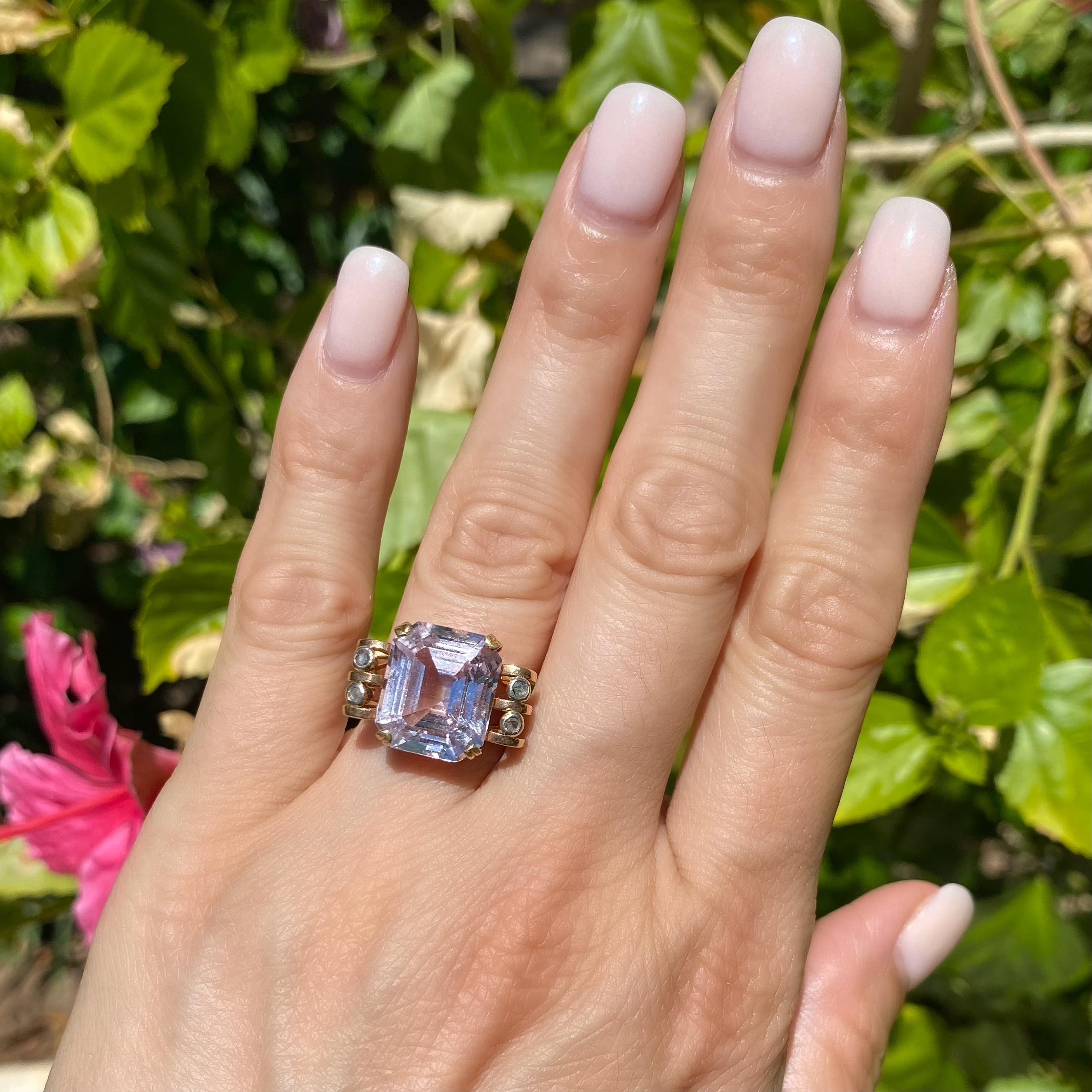 Simply Beautiful! Statement Solitaire Amethyst and Diamond Gold Cocktail Ring. Centering a securely nestled Hand set 5 Carat Emerald-cut Light Amethyst, accented on two levels by Diamonds, approx. 0.03tcw. Hand crafted 18K Rose Gold mounting.