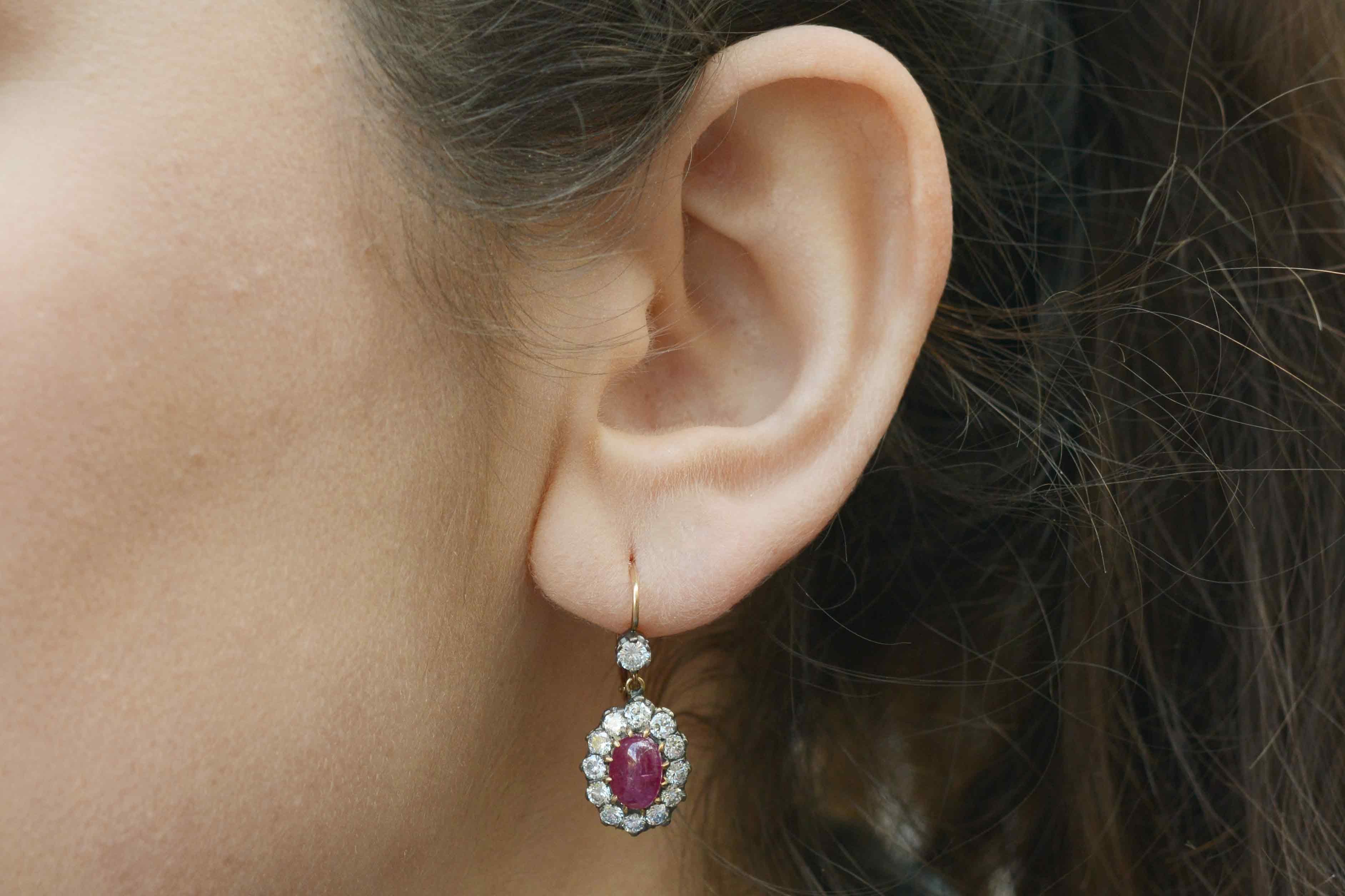 The Harlow antique ruby and diamond earrings are a throwback to the gilded age when Hollywood royalty like Jean Harlow wore clusters such as these. The central rubies, an intense, pigeon-blood red oval cabochon, together weigh 3.50 carats and are