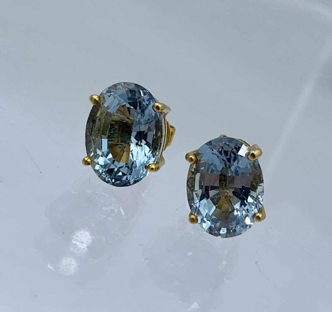 This is a gorgeous pair of 5.25 Carat Aquamarine Earrings in 14 Karat Yellow Gold.  The gorgeous Aquamarine gems have exquisite color and are beautifully cut to create radiant sparkling jewels.  The Aquas are oval faceted gems.  They are a gorgeous