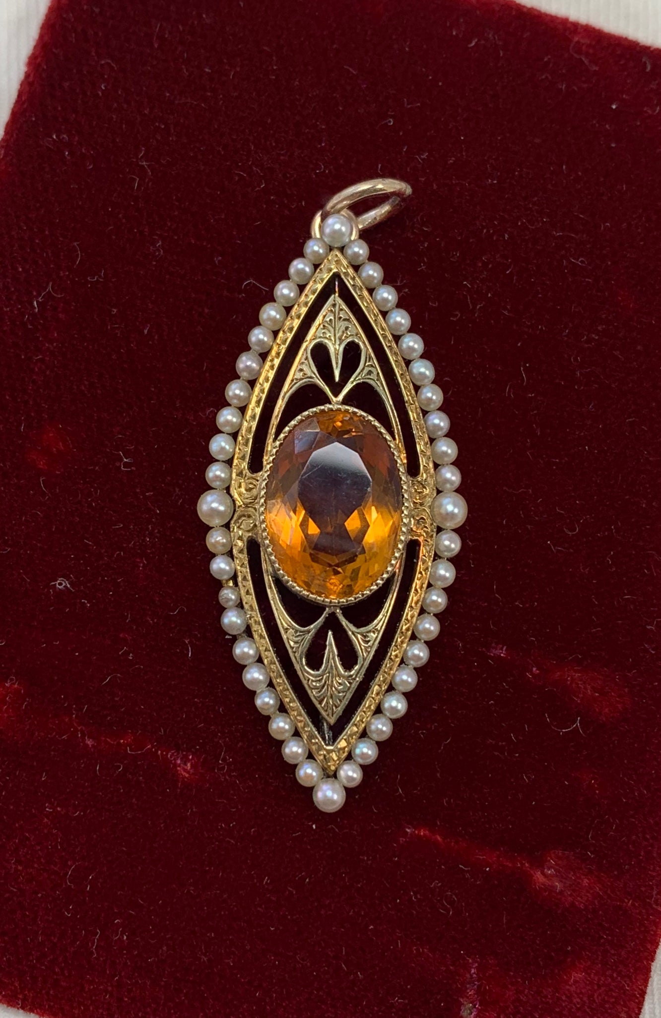 This is a beautiful Victorian - Art Deco Citrine Pearl Pendant in 14 Karat Gold.   The rare pendant is set with a stunning oval faceted Citrine of magnificent orange color.  The citrine is 13mm by 10mm by 7mm and is approximately 5 Carats.   The