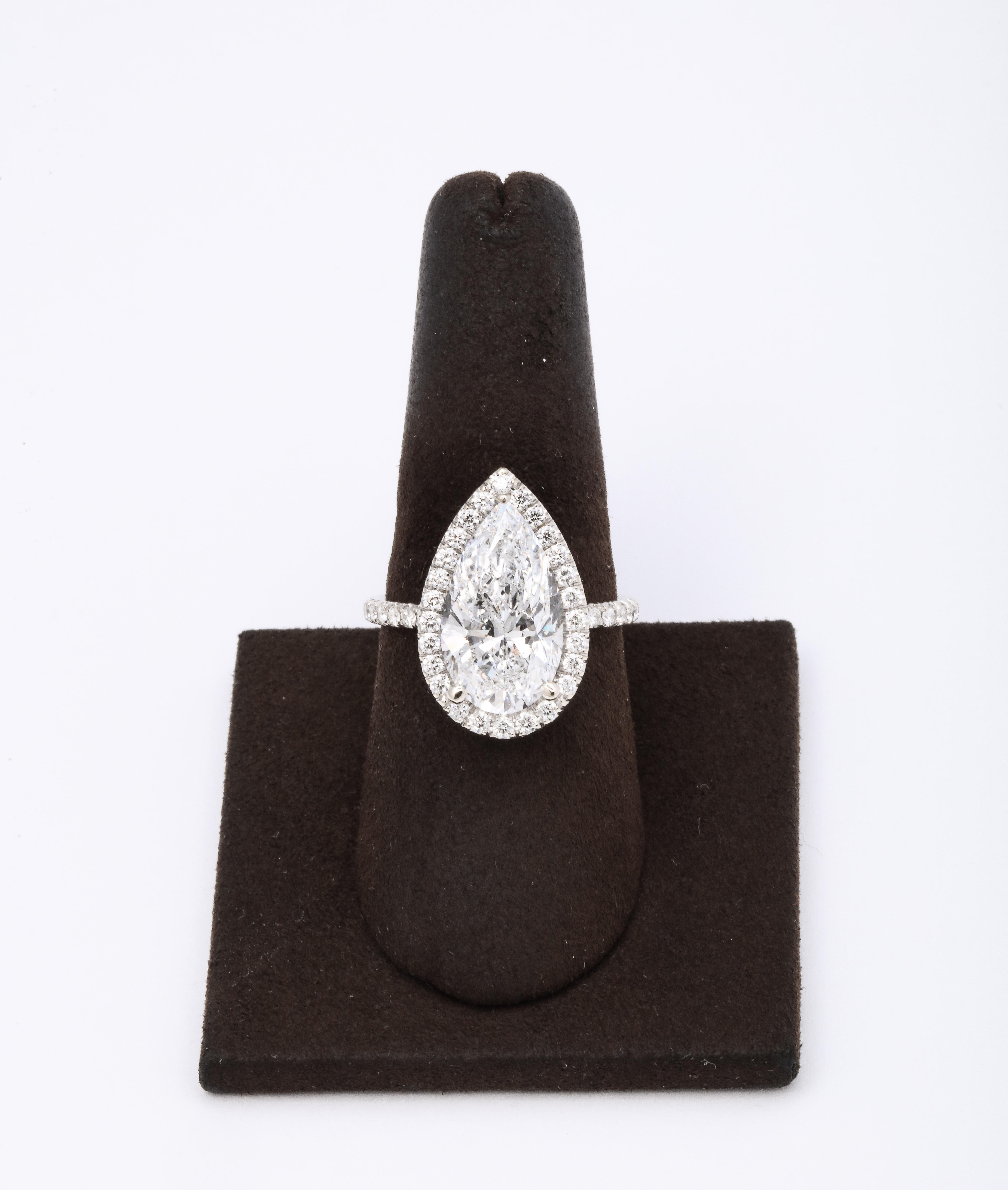 
The BEST color! 

GIA certified 5.21 carat D color I1 pear shape set in a platinum and diamond halo mounting with 1.35 carats of diamonds. 

The diamond is full of life and sparkle and is eye clean. 

A beautifully cut pear diamond with ideal