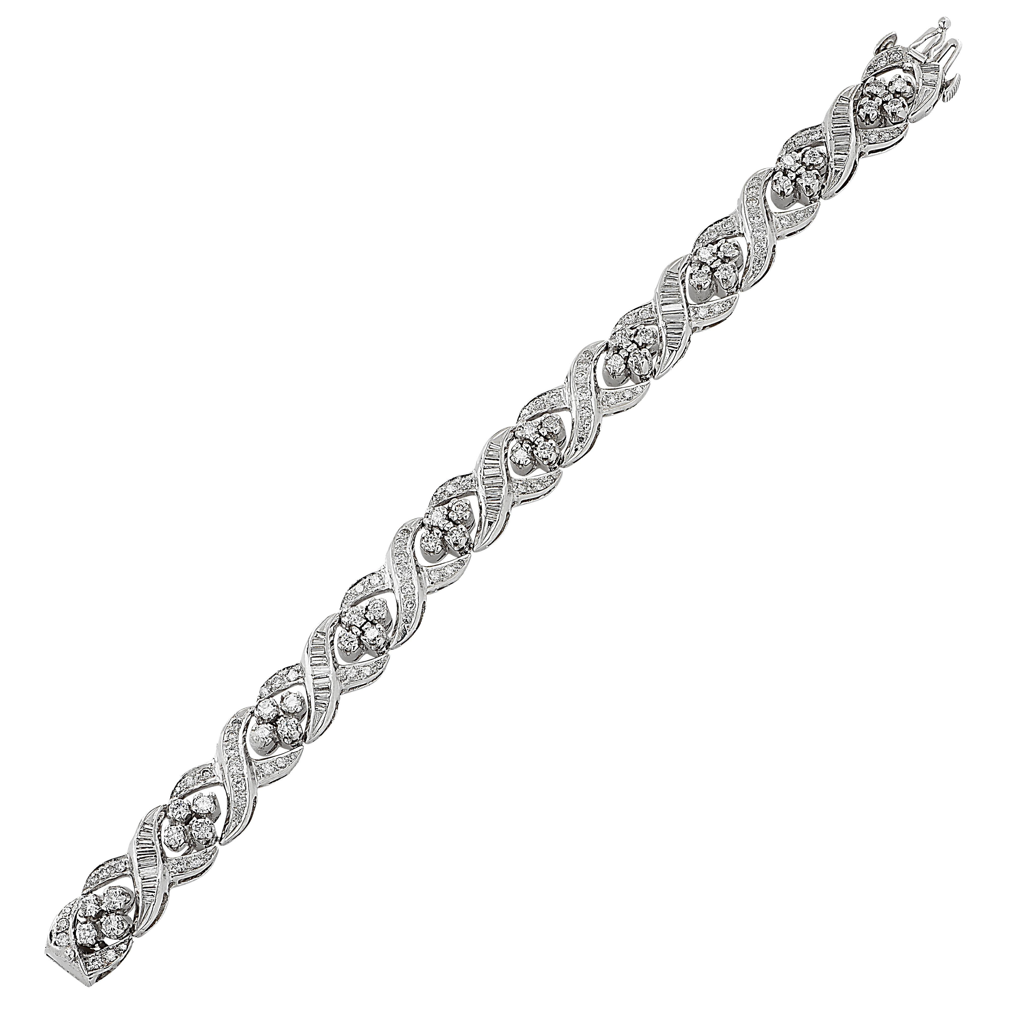Stunning diamond bracelet circa 1960 crafted in platinum, showcasing 193 mixed cut diamonds weighing approximately 5 carats total, I-J color, VS-SI clarity. Typical of the 1960s, this spectacular bracelet features round cut and baguette cut