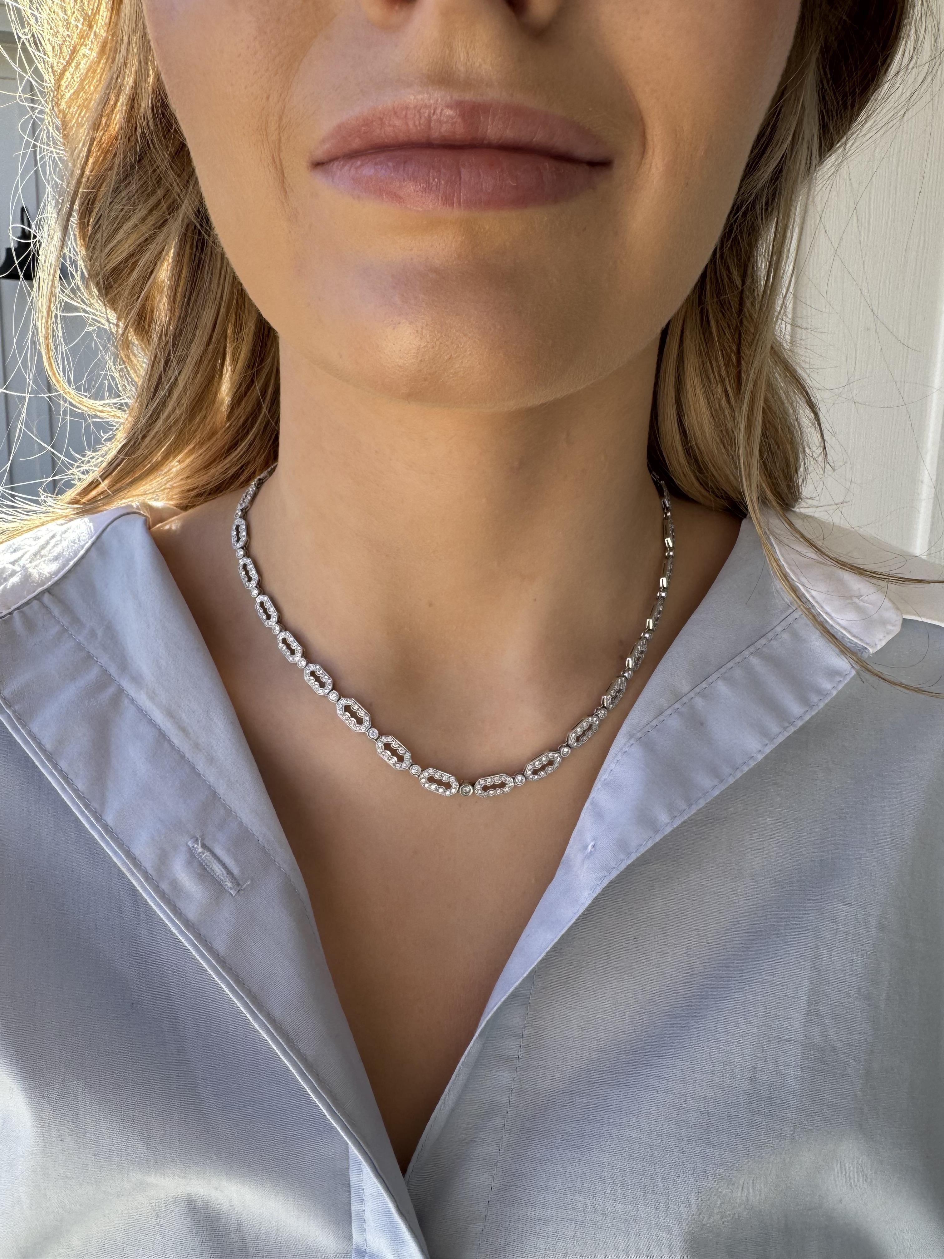 We love this unique necklace!!
She has the perfect detailed look for everyday love & wear.

Necklace Details
Material: 18K White Gold
Length: 16 Inches
Width: 5.8mm
Weight: 23.3 Grams

Accented by the following gemstones
29 - 2.4mm Round Brilliant
