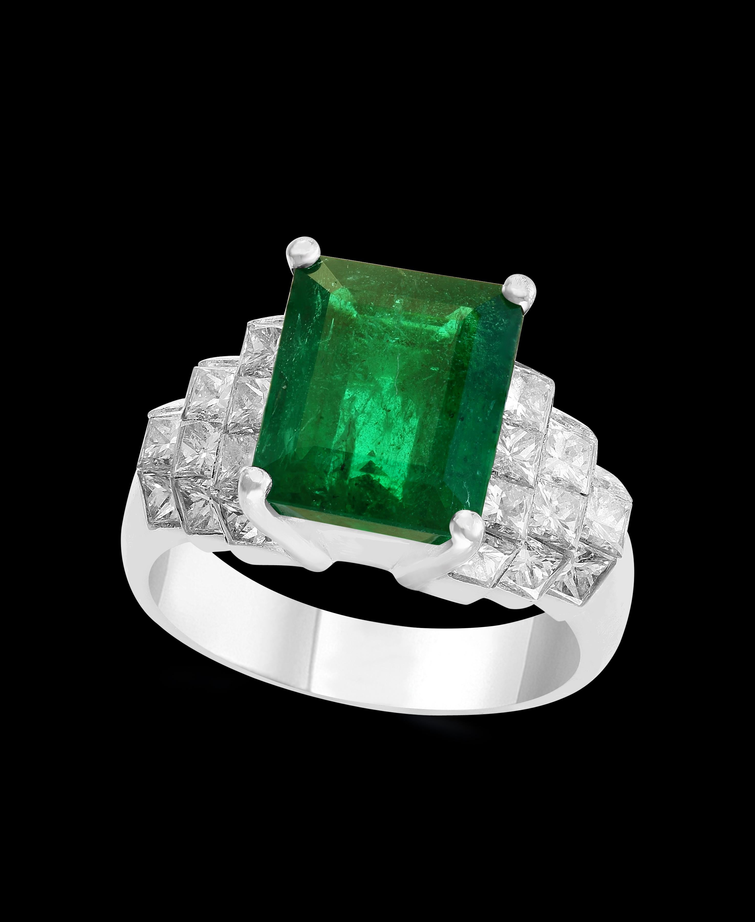 A classic, Cocktail ring 
5 Carat   Emerald and Diamond Ring, Estate.
Platinum 11.39 gm
 Diamonds: approximate 1.75 Carat 
Emerald: 5.0 ct
Color: Deep  Green, Transparent extreme Fine Color Quality
One of our finest Colombian Emerald ring.
Cut: