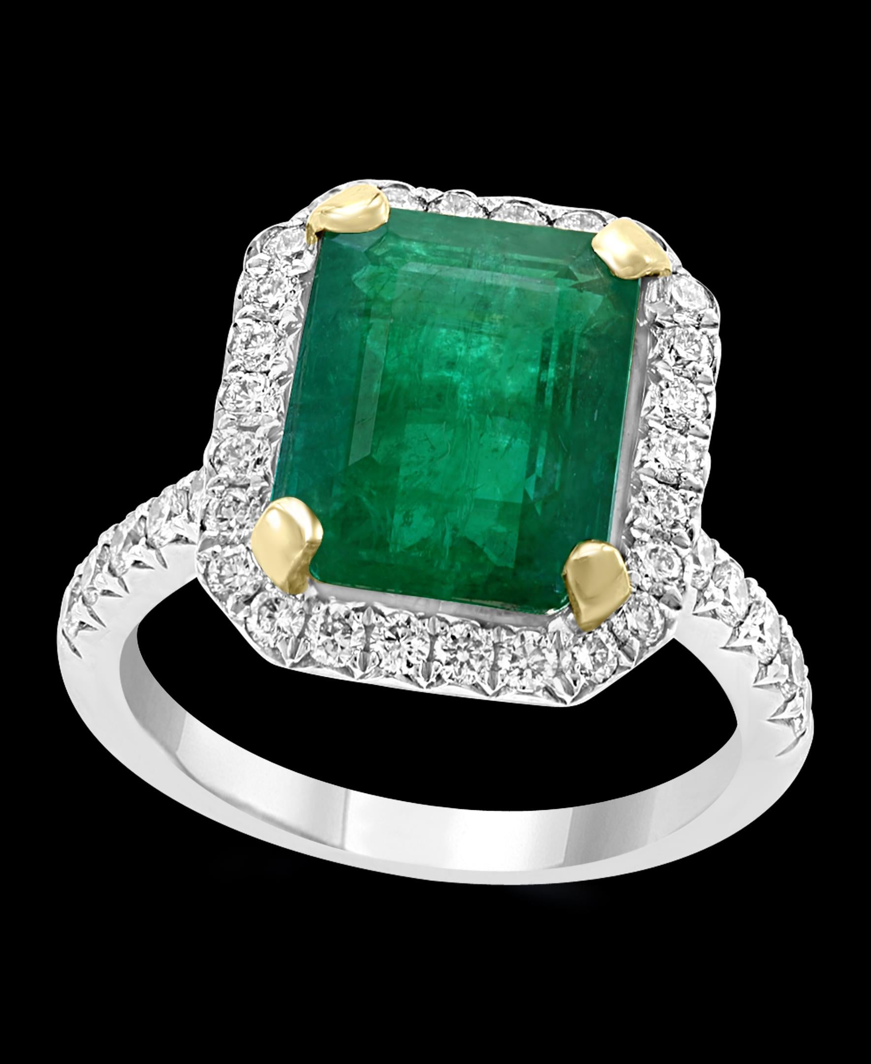 A classic, Cocktail ring 
Approximately 5 Carat  Emerald and Diamond Ring, Estate
Gold: 18 Karat white gold 
Weight: 6.5gm
Ring size 6
 Diamonds: approximate 1.0 Carat 
Measurements of the Emerald is 9 X11 X7.5 which comes out to Estimated Weight