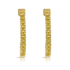 Cerchi con diamante giallo intenso da 5 carati