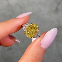 5 Carat Fancy Intense Yellow Oval Diamond Three Stone Engagement Ring