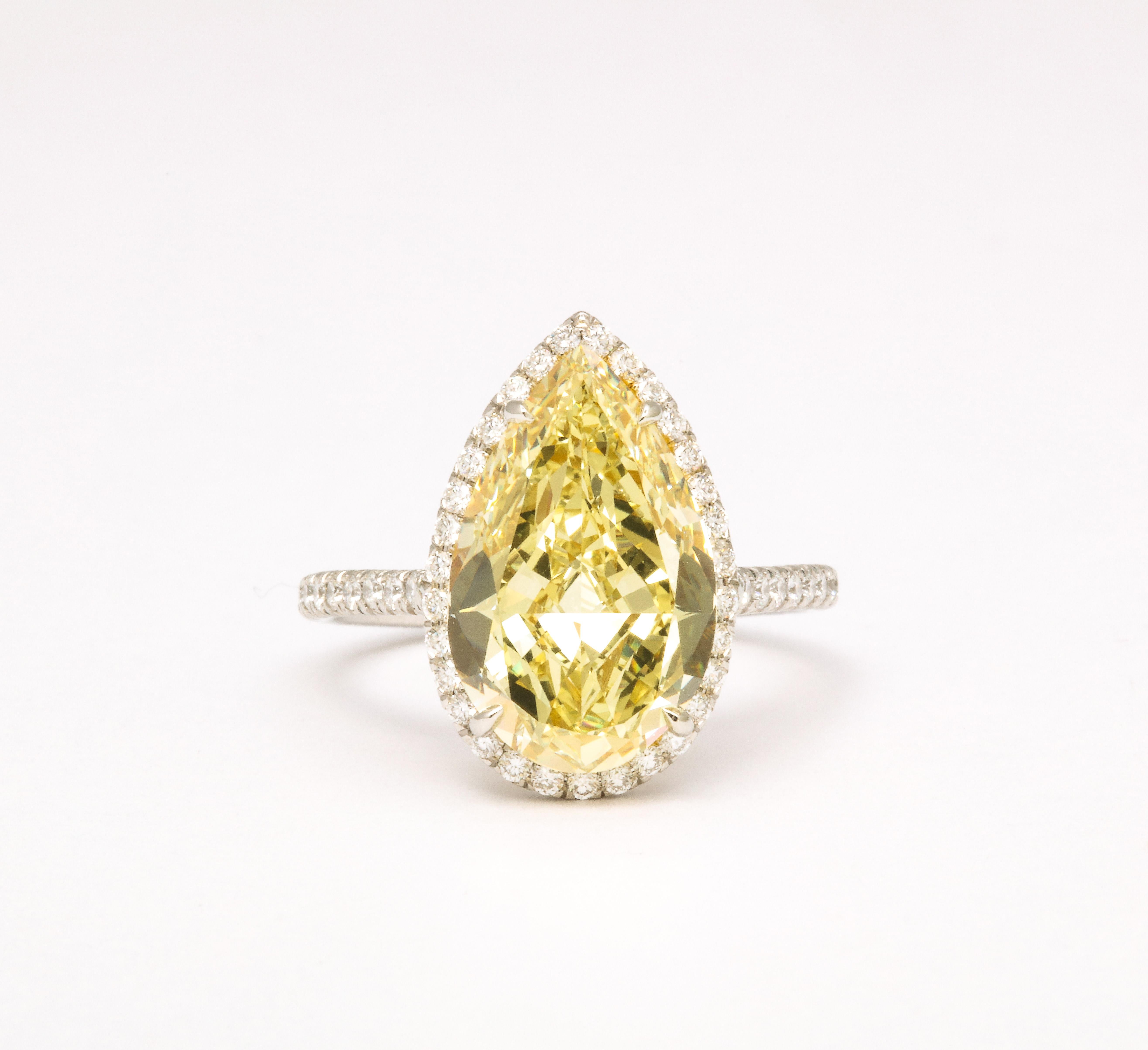 
A FABULOUS pear shape!

GIA certified 5.12 carat Fancy Yellow, VS1 clarity pear shape center diamond. 

.85 carats of white colorless round brilliant cut diamonds set in a custom platinum and 18k yellow gold mounting. 

The center diamond measures