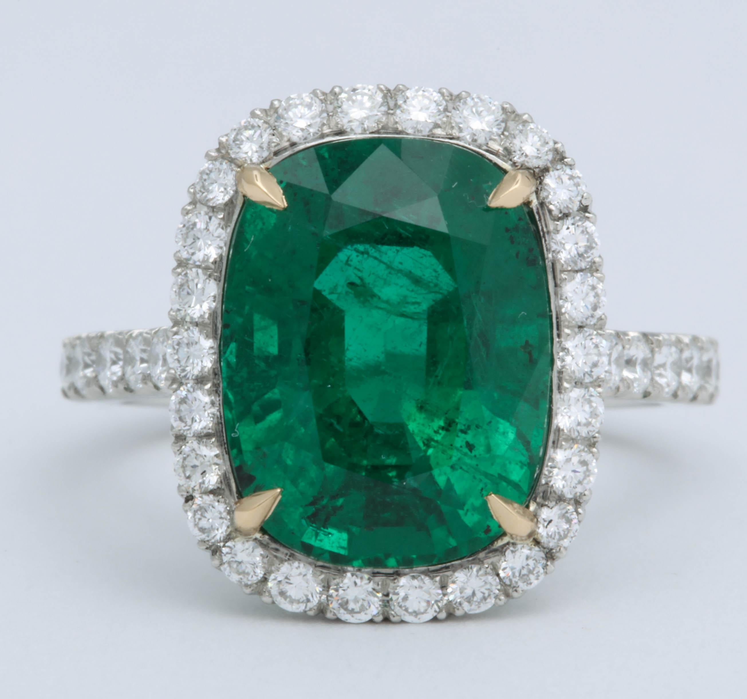 
A beautiful Green Emerald cut in an elongated cushion shape!!

5.21 carat cushion cut emerald with ZERO treatment -- NO OIL as stated on the GIA certificate. 

This completely natural beauty is set in an 18k yellow gold and platinum diamond setting