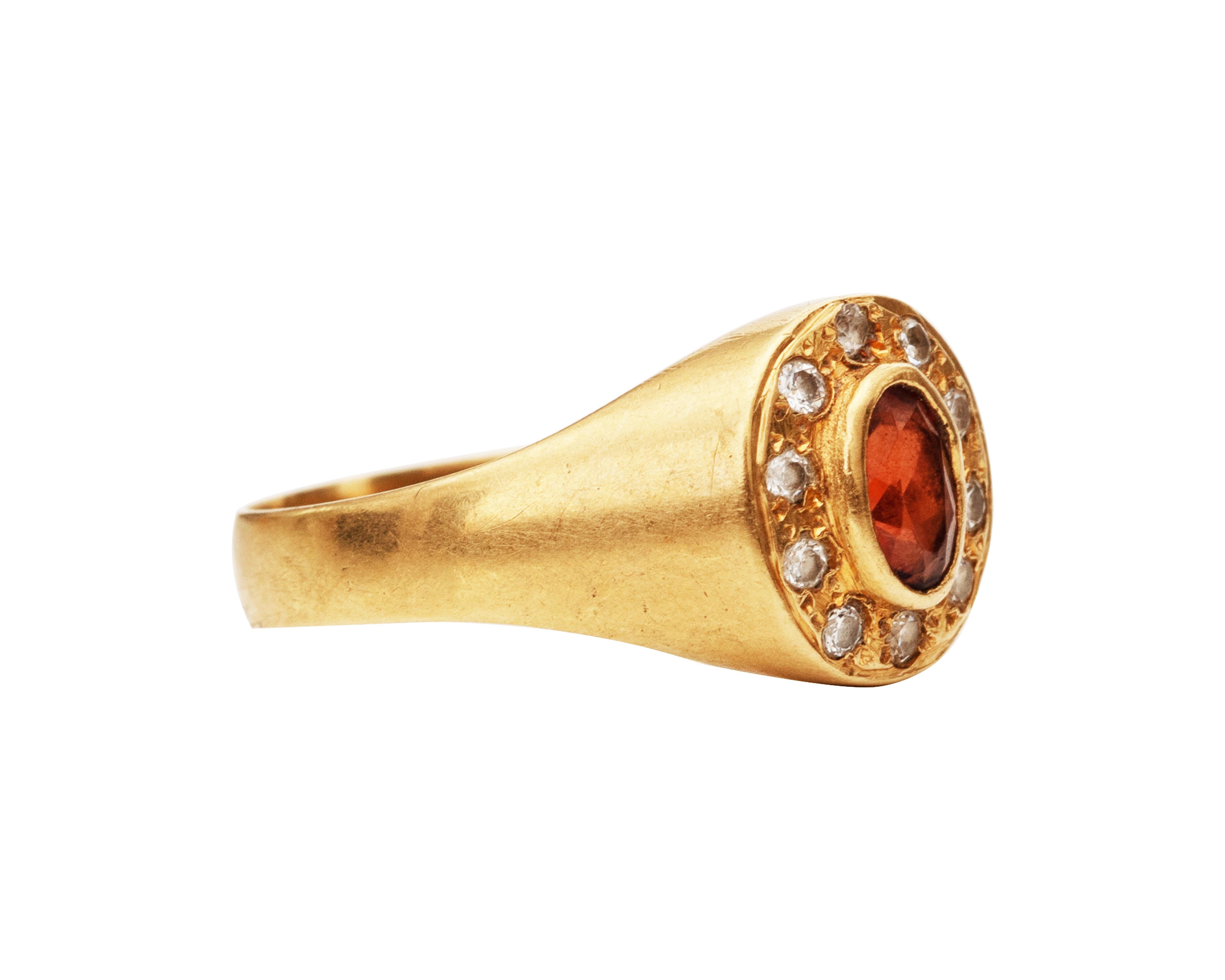 This ring is from the 1980s. It features a stunning imperial topaz in the center that is bezel set. The yellow gold has a striking contrast with the hues of topaz. 

Item Details:
Metal type: 18 Karat Gold
Size: 7
Weight: 3.13 grams

Diamond
