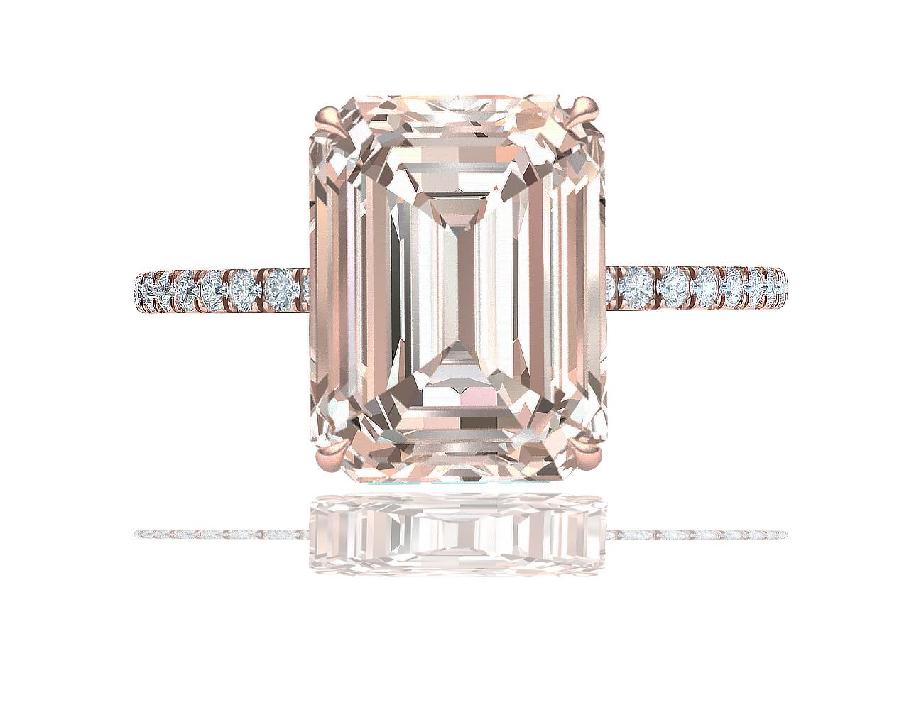The beauty of rose gold captured in a diamond can be seen in the center stone of this truly one-of-a-kind engagement ring.  The center of this ring showcases a 5-carat emerald-cut which has a color and clarity of Light Brown and VS clarity.  The