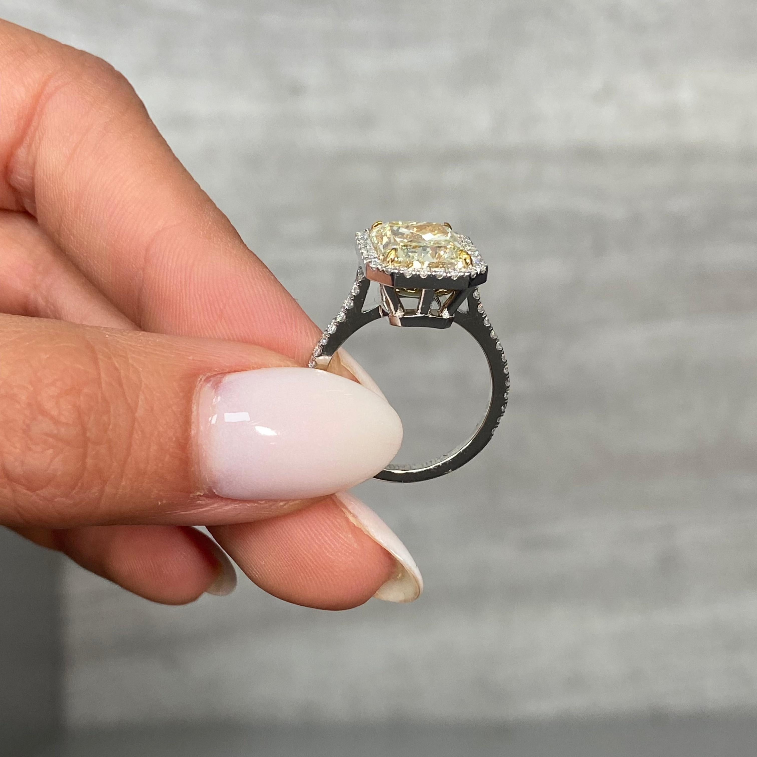 5.03 Carat 
Light Yellow (U-V)
VS2 Clarity 
Radiant Cut Diamond 
0.59 Carats of White Rounds 
GIA Certified Diamond 
Crafted in Platinum and 18k Yellow Gold 
Handmade in NYC

This piece can be viewed before purchase in our showroom in NYC, or at one
