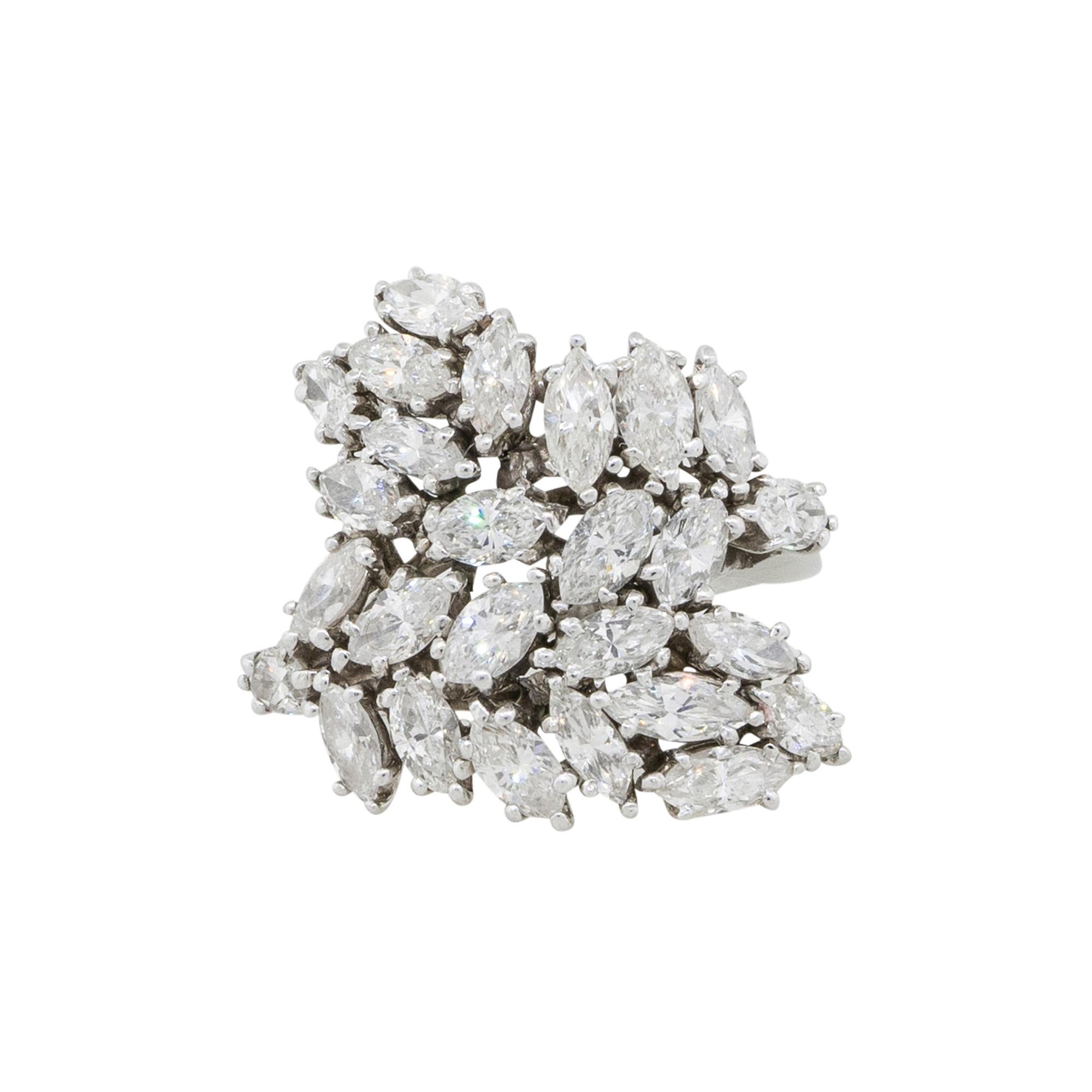 Material: Platinum
Diamond Details: Approx. 5ctw of marquise shaped Diamonds. Diamonds are G in color and VS in clarity
Ring Size: 6.5 
Ring Measurements: 23.5mm x 23mm x 24mm
Total Weight: 12g (7.7dwt)
Additional Details: This item comes with a