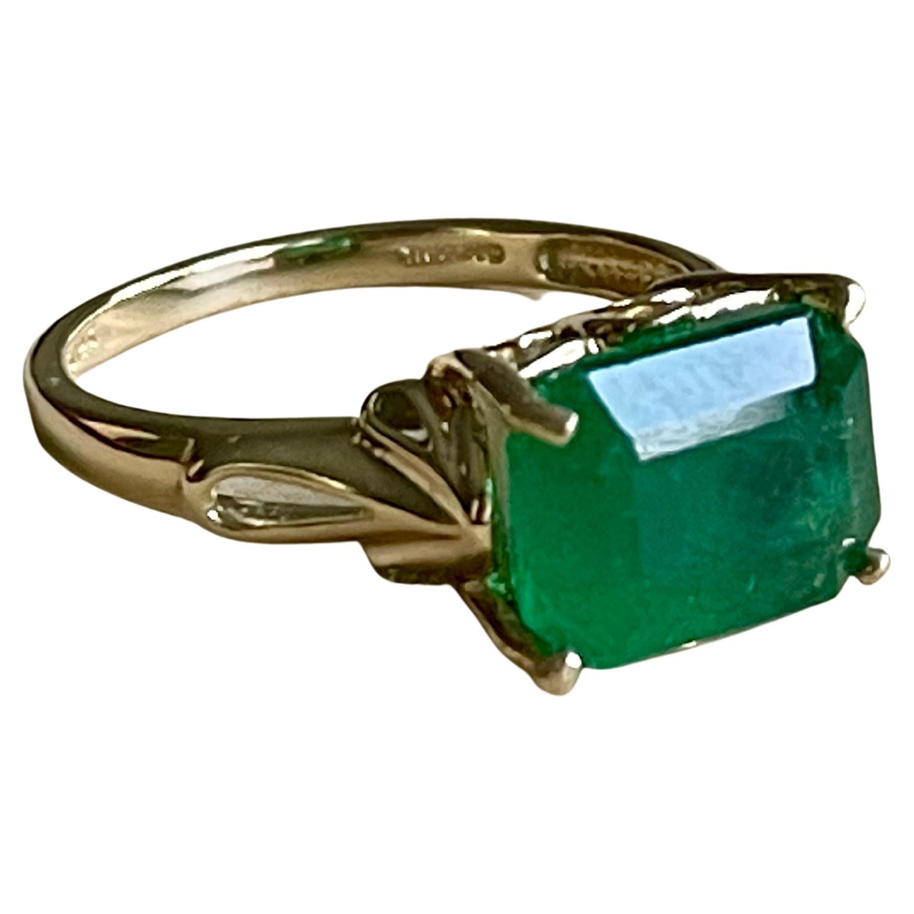 A classic, Cocktail ring 
10X12 Emerald  cut Emerald  Ring 14 Karat Yellow Gold Size 8
Emerald cut emerald is the most popular and in demand  Emerald 
Large size Emerald cut Emerald Intense green color with lots of shine and brilliance but has