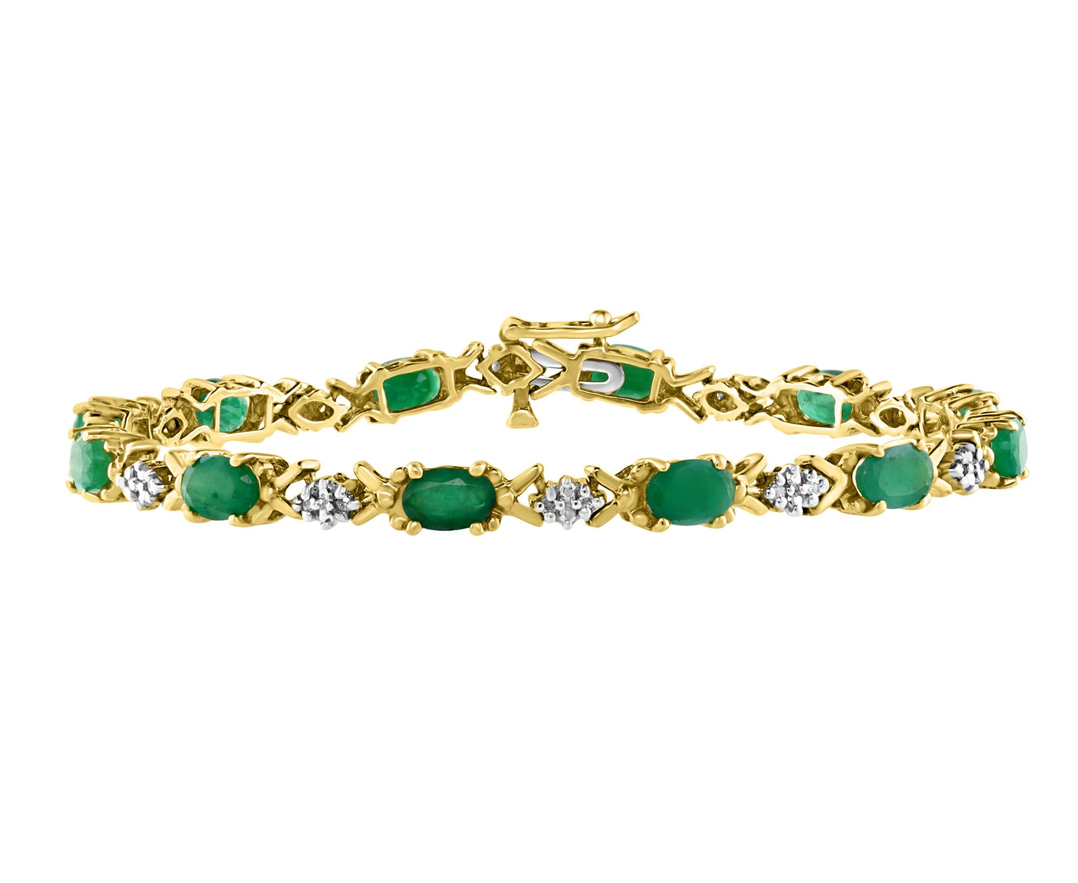  5 Carat Natural Emerald Tennis Bracelet 10 Karat Yellow Gold with Diamond Accent
This exceptionally affordable Tennis  bracelet has 12 stones of oval shape natural emeralds
Emeralds are Brazilian quality is low 
This is a clearance item as i am