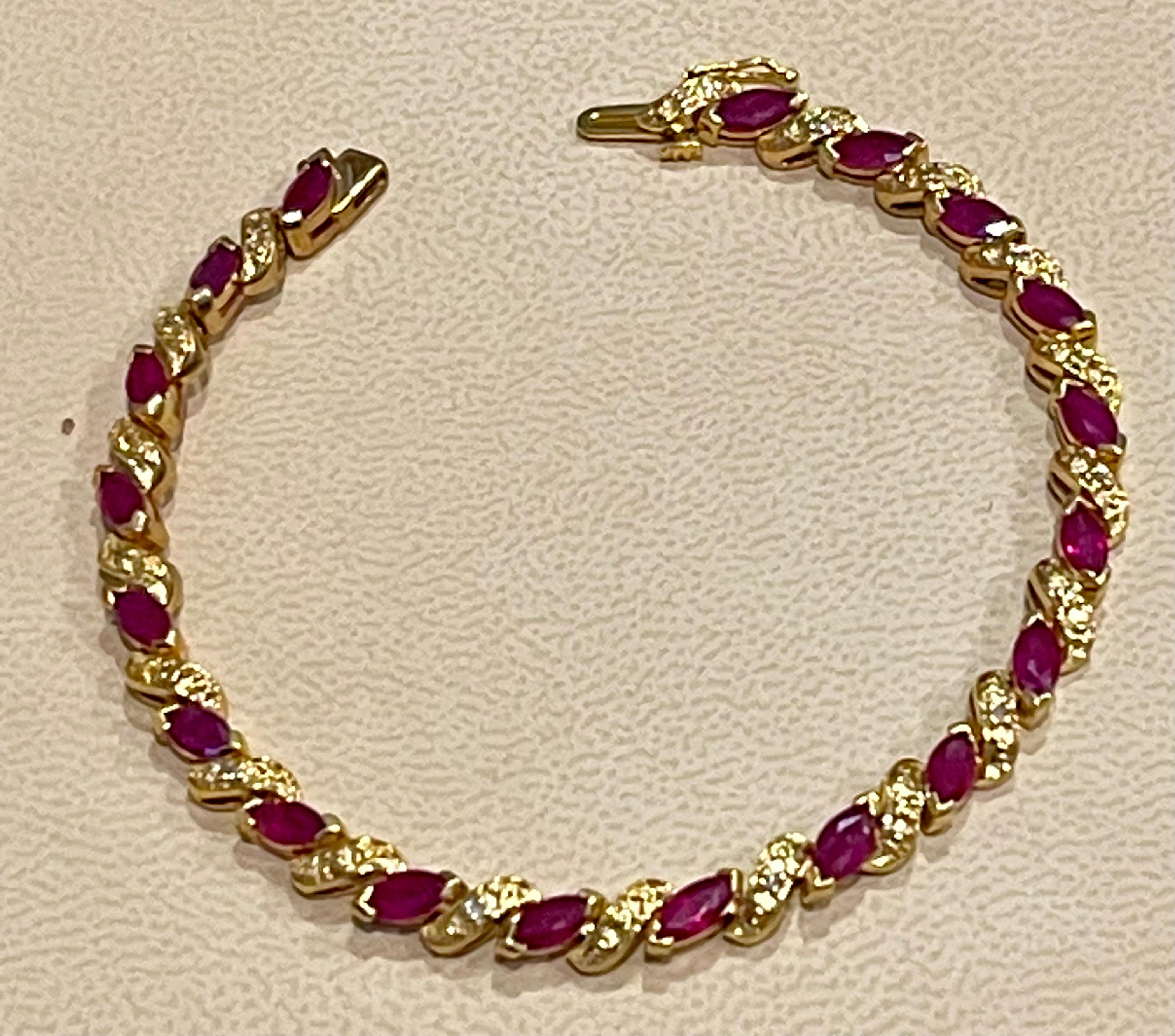  This bracelet boasts marquise-cut  Rubies in 14k Yellow Gold.
 prong settings, beautifully complemented by glittering s shape gold links
 Together these elements make this bracelet beautiful. . These are natural Rubies
 They have a signature medium