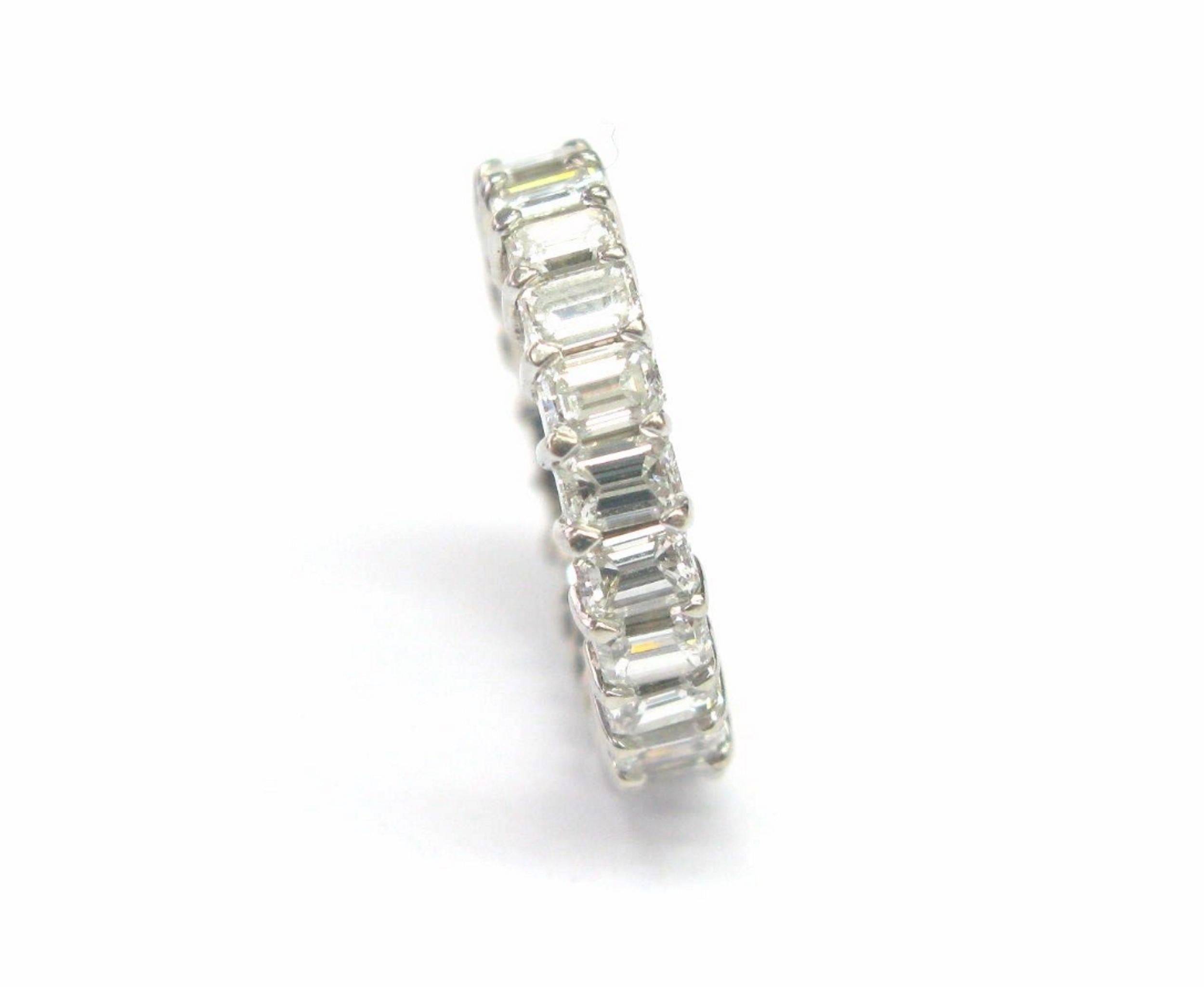 Eternity band shared tips with fine emerald cut diamond. 
Made of solid 14Kt white gold and weighs approximately 5 grams. Contains 24 natural emerald cut diamonds which add to approx. 5 Ct color F - G clarity VS1, full of shine and fire. Very well