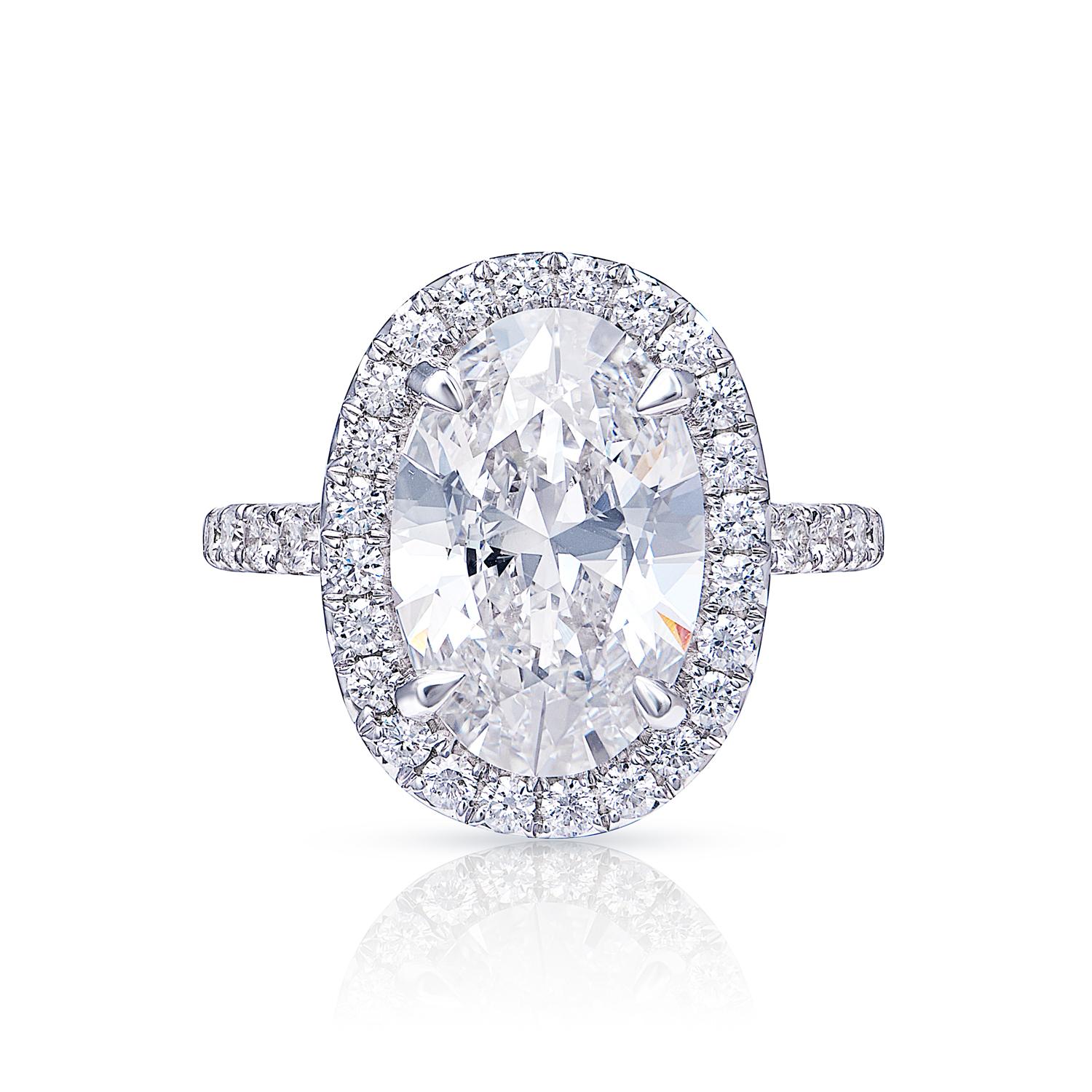 Introducing the GIA-Certified Oval Cut Diamond Ring, a stunning piece of jewelry that is sure to take your breath away. This ring features a beautiful oval-cut diamond that has been certified by the Gemological Institute of America (GIA), ensuring