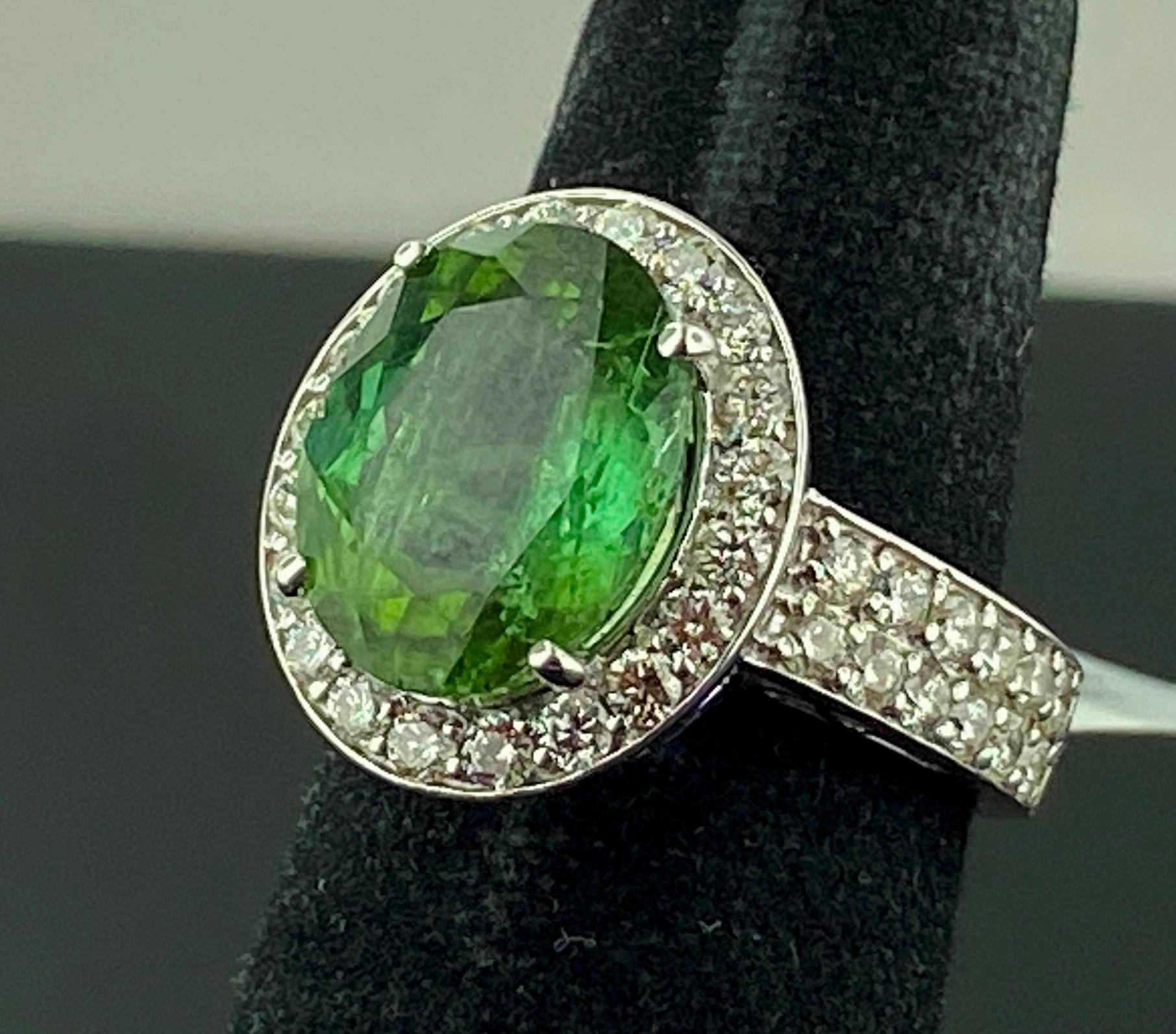 Women's or Men's 5 Carat Oval Cut Green Tourmaline and Diamond Ring in White Gold For Sale