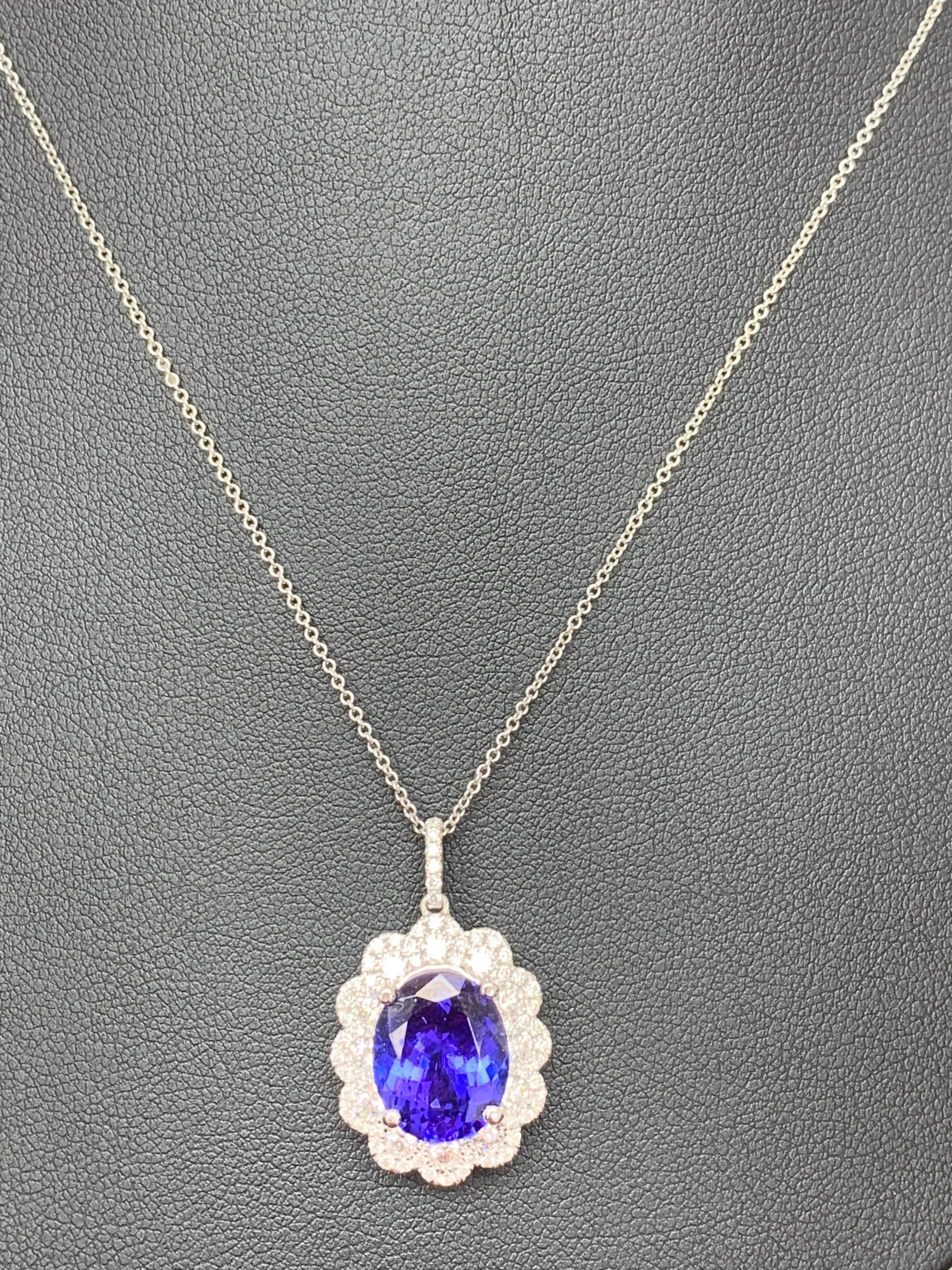 Modern 5 Carat Oval Cut Tanzanite and Diamond Halo Flower Pendant Necklace For Sale