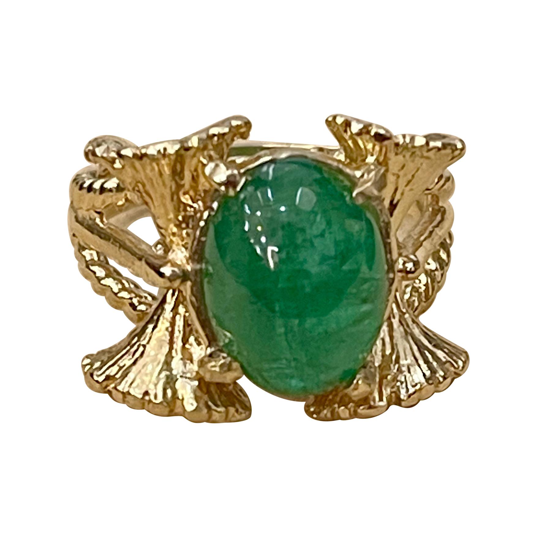 A classic, Cocktail ring 
Large size Emerald  cabochon approximately 5 Carat Emerald , Estate with no color enhancement. 
Gold: 14 Karat Yellow  gold ,
Weight: 10.4  gram with stone 
simple ring , no bling 
Emerald: 5 Carat 
Origin : Zambia
Color: