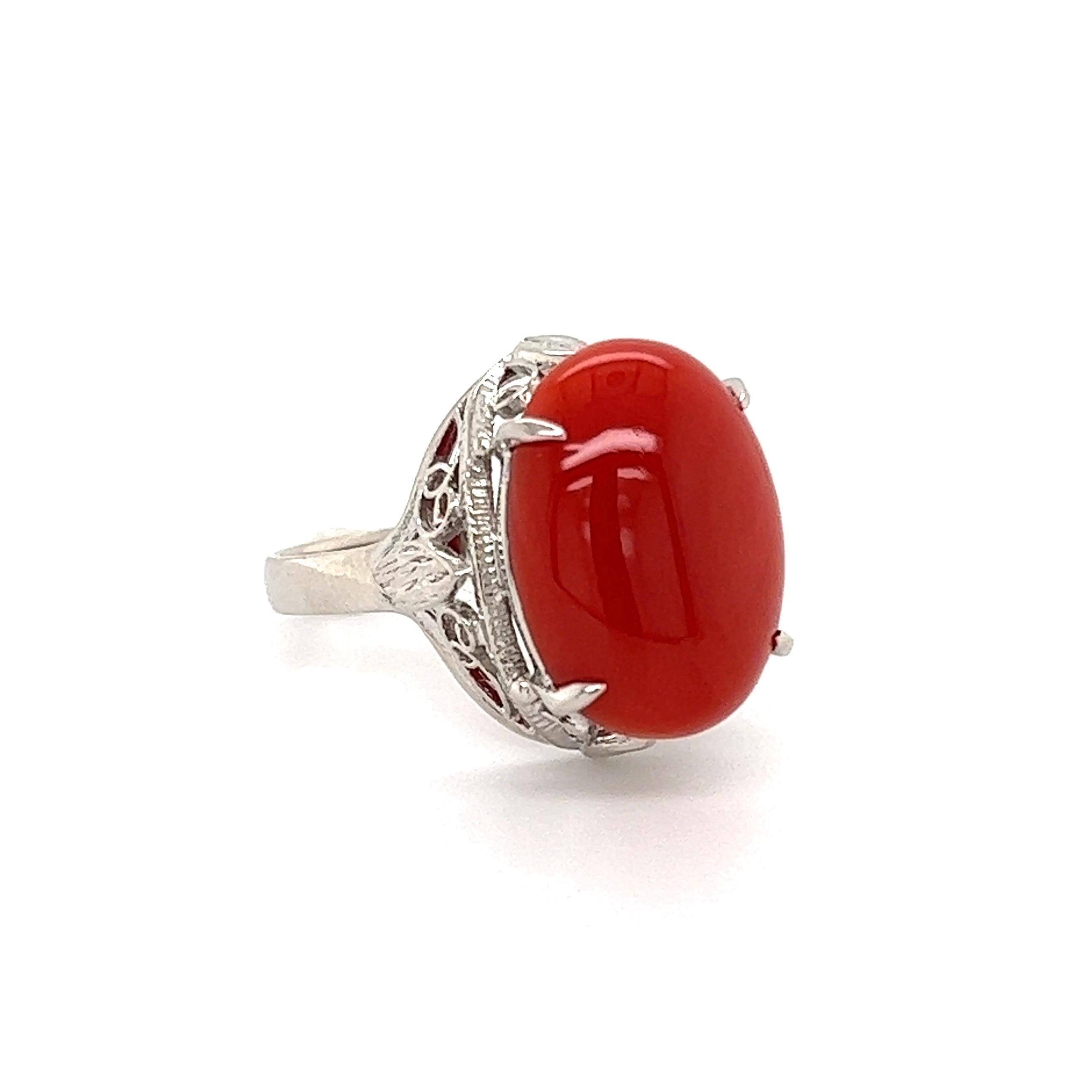 Simply Beautiful and finely detailed Cabochon Red Coral and Diamond Cocktail Ring. Center securely set with an awesome 5 Carat Cabochon Red Coral. Hand crafted Platinum mounting. Approx. dimensions: 1.12