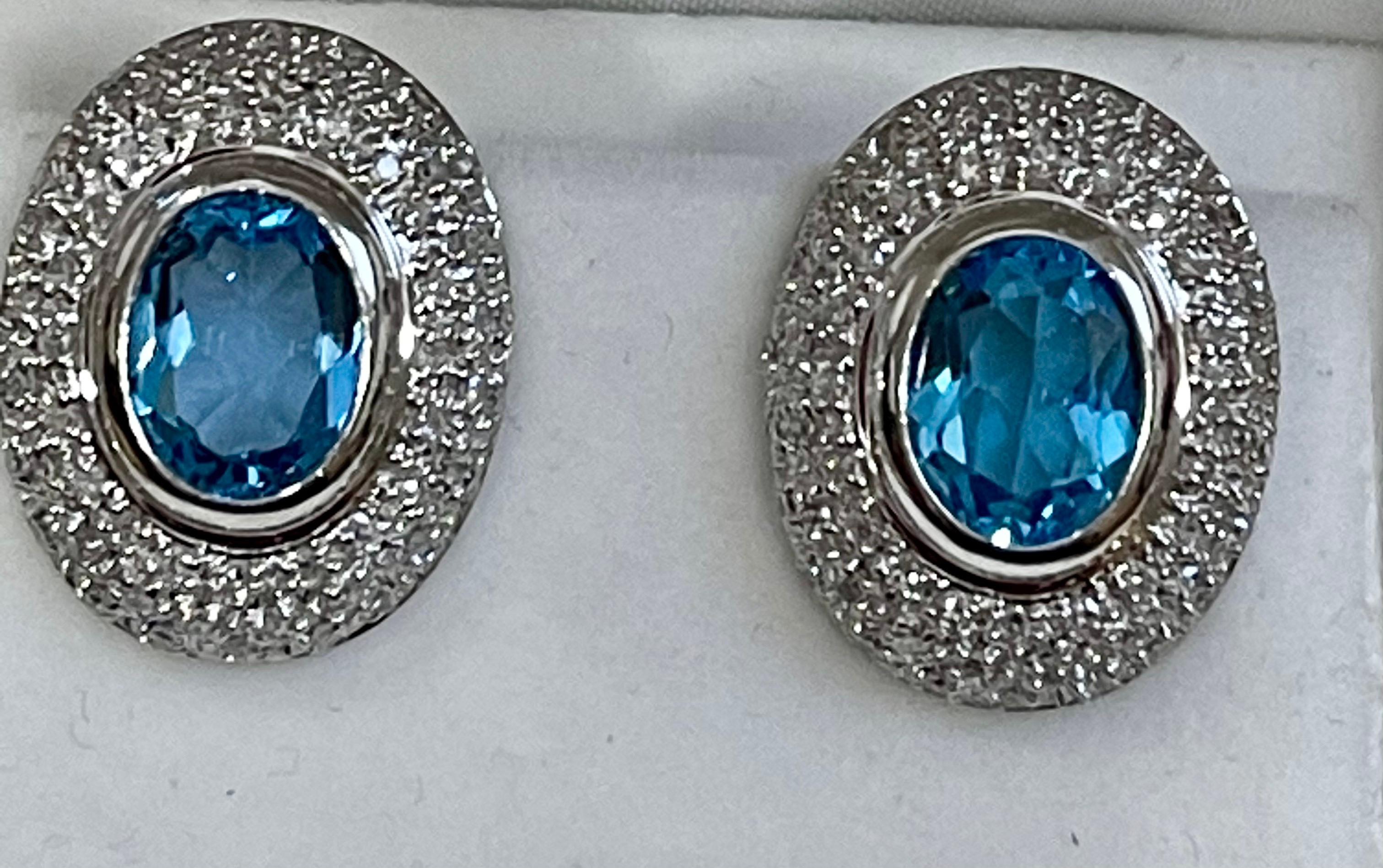 
5 Carat Oval Shape Blue Topaz & Diamond Omega Back Clip Earring 14 Karat White Gold
Two Blue Topaz weighing approximately 5 carats Total
Each Blue Topaz is over 2.5 ct
Natural Nice Blue topaz
Brilliant cut round diamonds about 0.6 ct
This exquisite