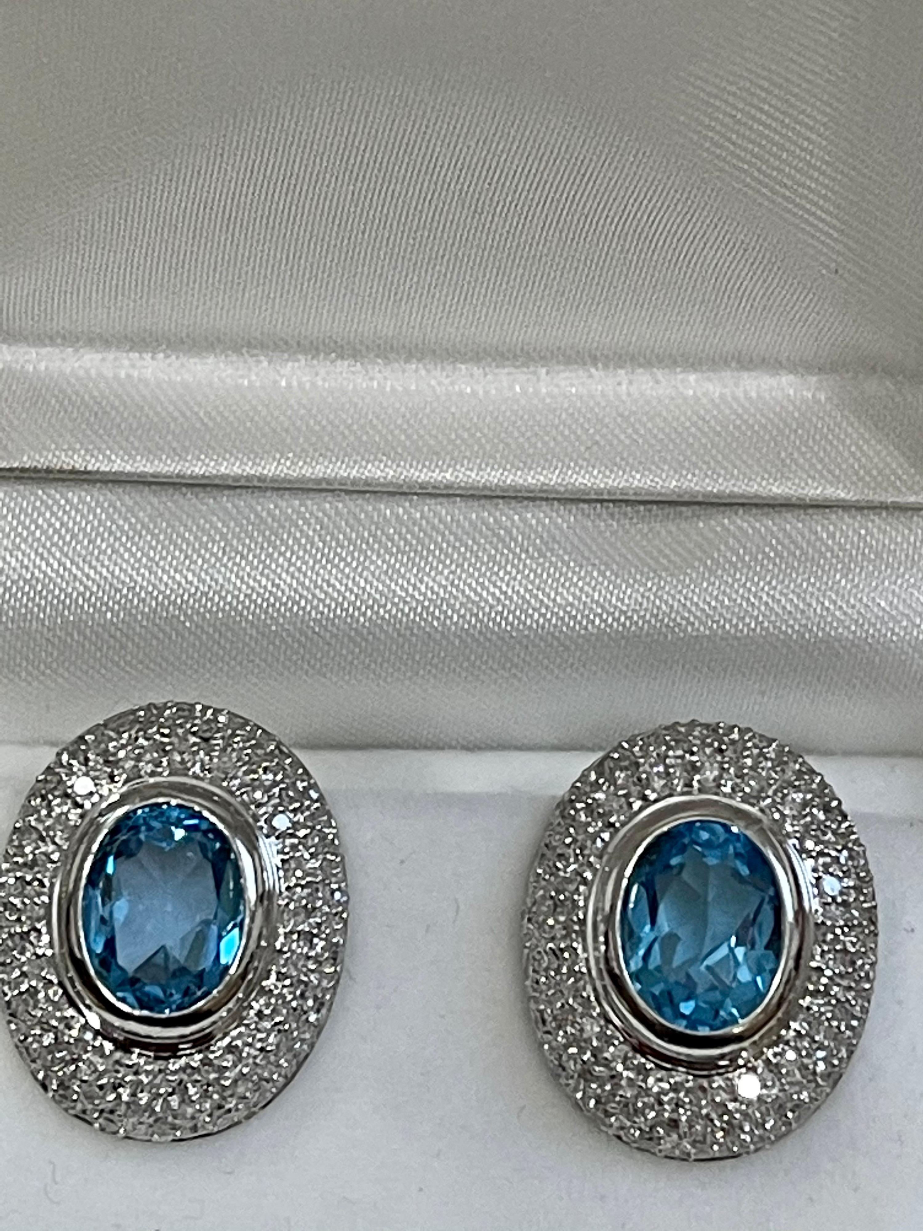Oval Cut 5 Carat Oval Shape Blue Topaz and Diamond Omega Back Clip Earring 14 Karat Gold For Sale