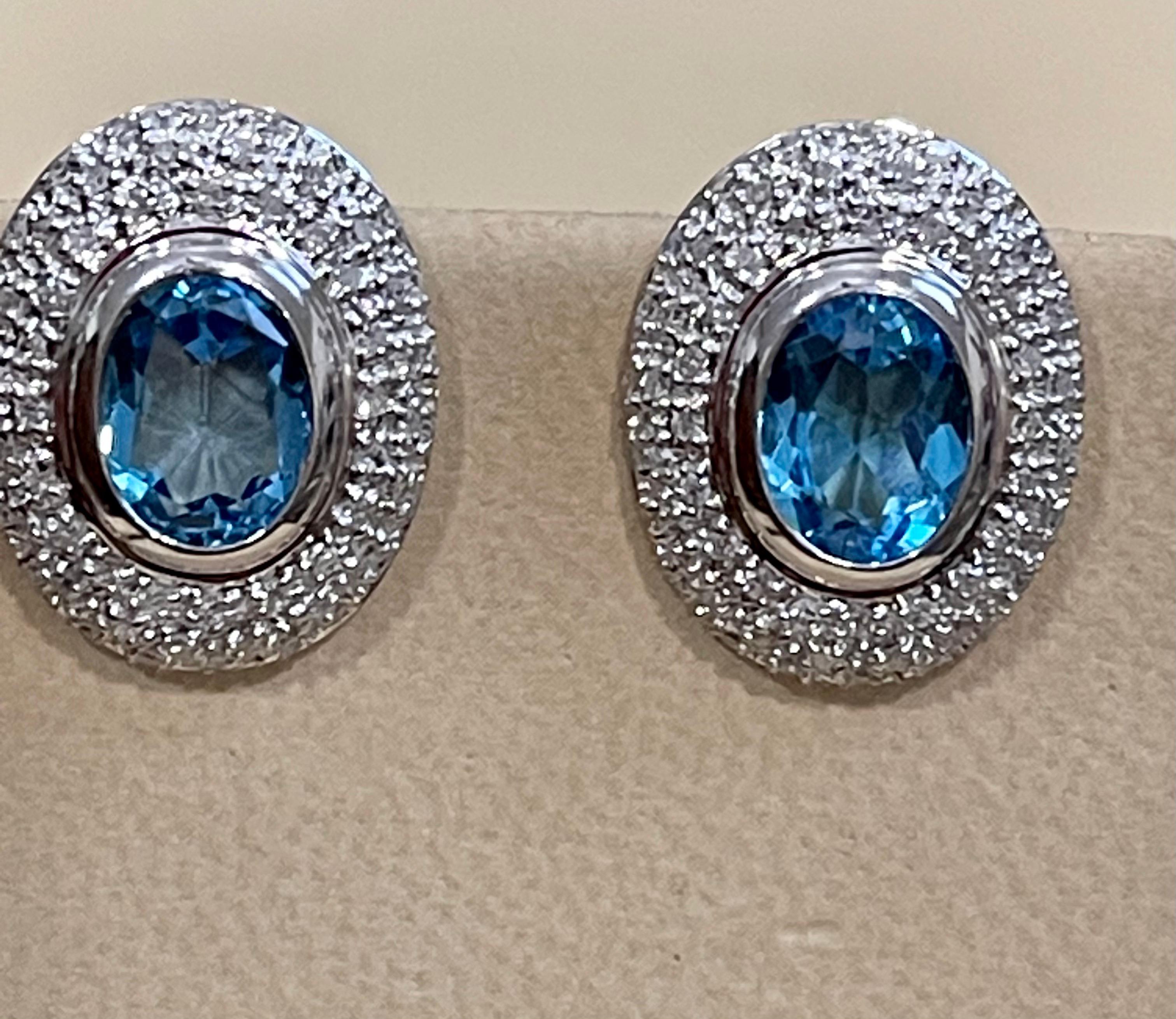 Women's 5 Carat Oval Shape Blue Topaz and Diamond Omega Back Clip Earring 14 Karat Gold For Sale