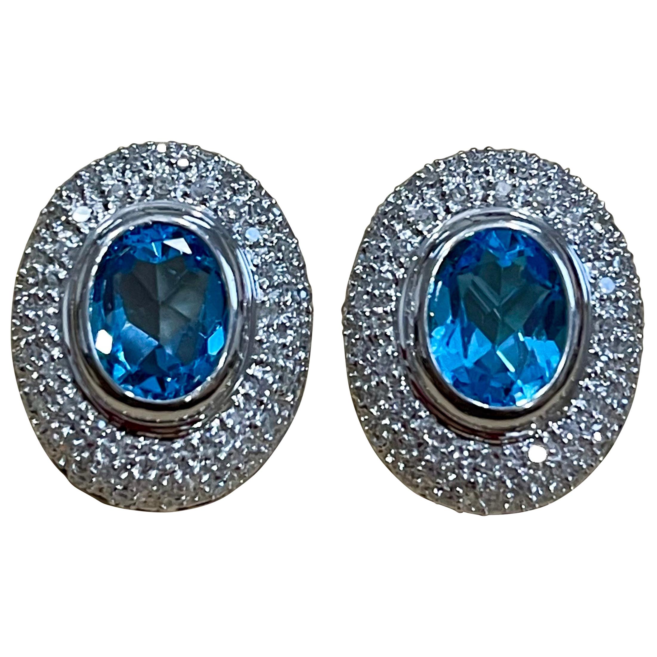 5 Carat Oval Shape Blue Topaz and Diamond Omega Back Clip Earring 14 Karat Gold For Sale