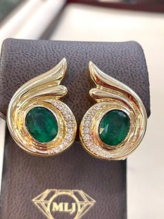5 Carat Oval Shape Emerald and Diamond Omega Back Earrings 14 Karat Yellow Gold
