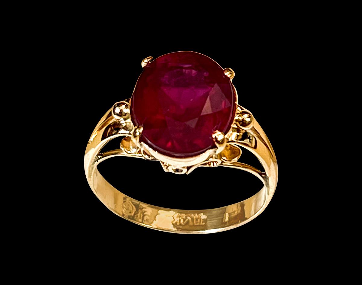 9X11  Oval  Cut  approximately 5 Carat Treated Ruby  14 Karat Yellow Gold Ring Size 5
Its a treated ruby
 prong set
14 Karat Yellow Gold: 3.2 gram
Ring Size 5( can be altered for no charge )
Simple ring for the people  who don't like bling of