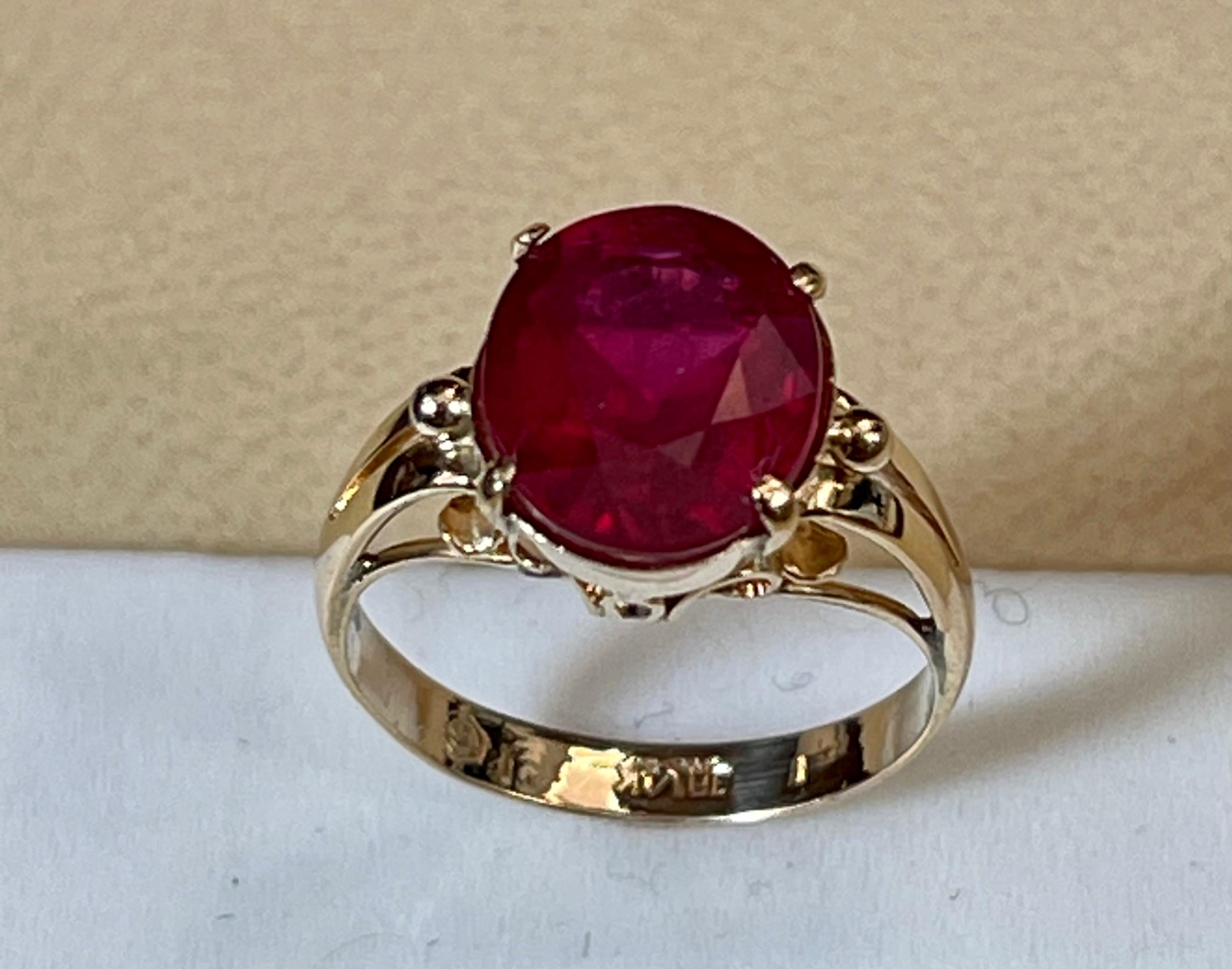 Women's 5 Carat Oval shape Treated Ruby 14 Karat Yellow Gold Ring For Sale