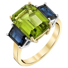 5 Carat Peridot and Blue Sapphire Three-Stone Ring in White and Yellow Gold