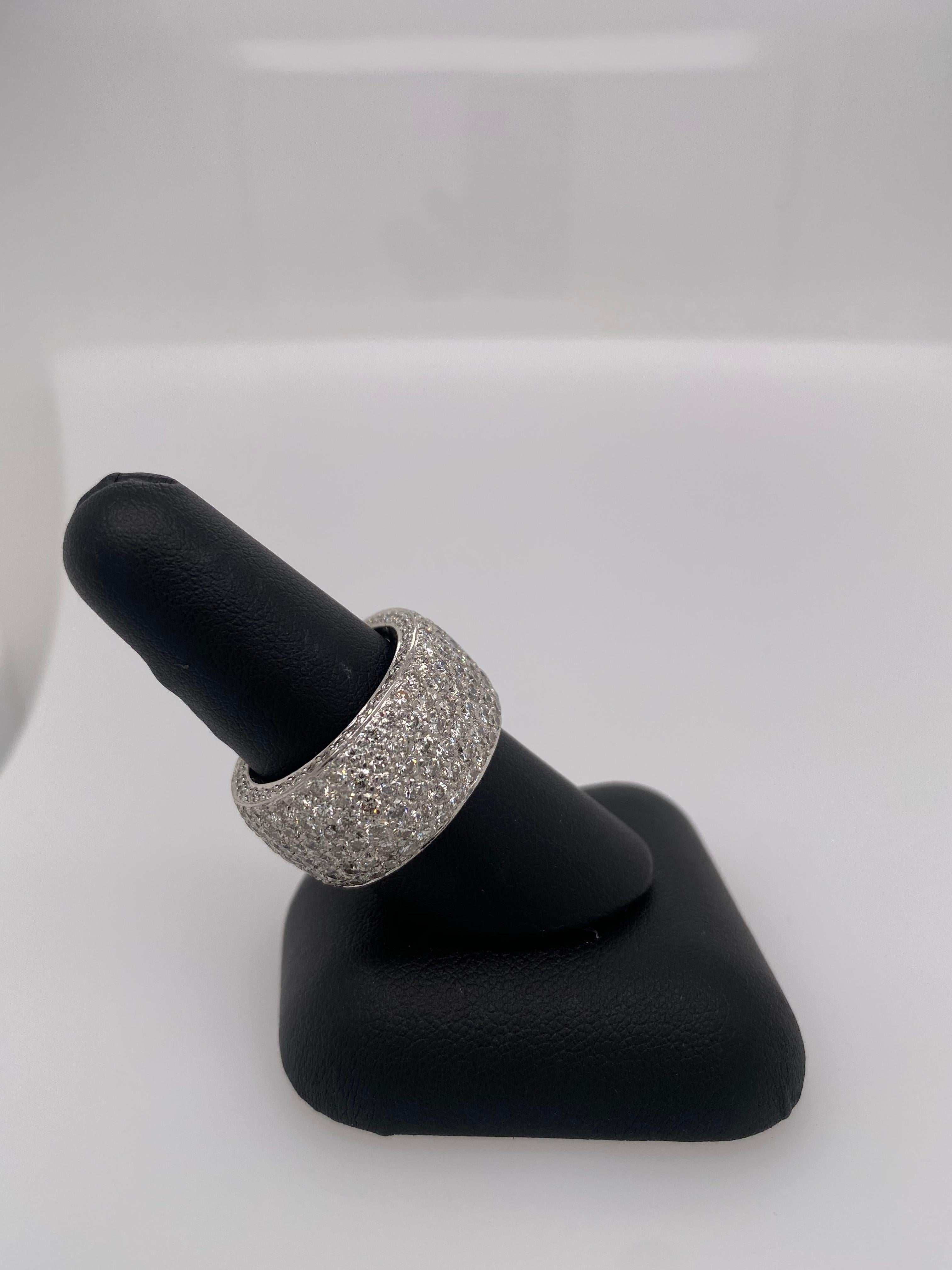 This 5 carat Platinum Diamond Pave band is a sure show stopper, sure to WOW anyone! This ring is the perfect wedding band or everyday ring.  Size 7 1/2-3/4.  12.8 mm wide and a whopping 5 carats of white diamonds.  E-G color and VS1-2 grade. 