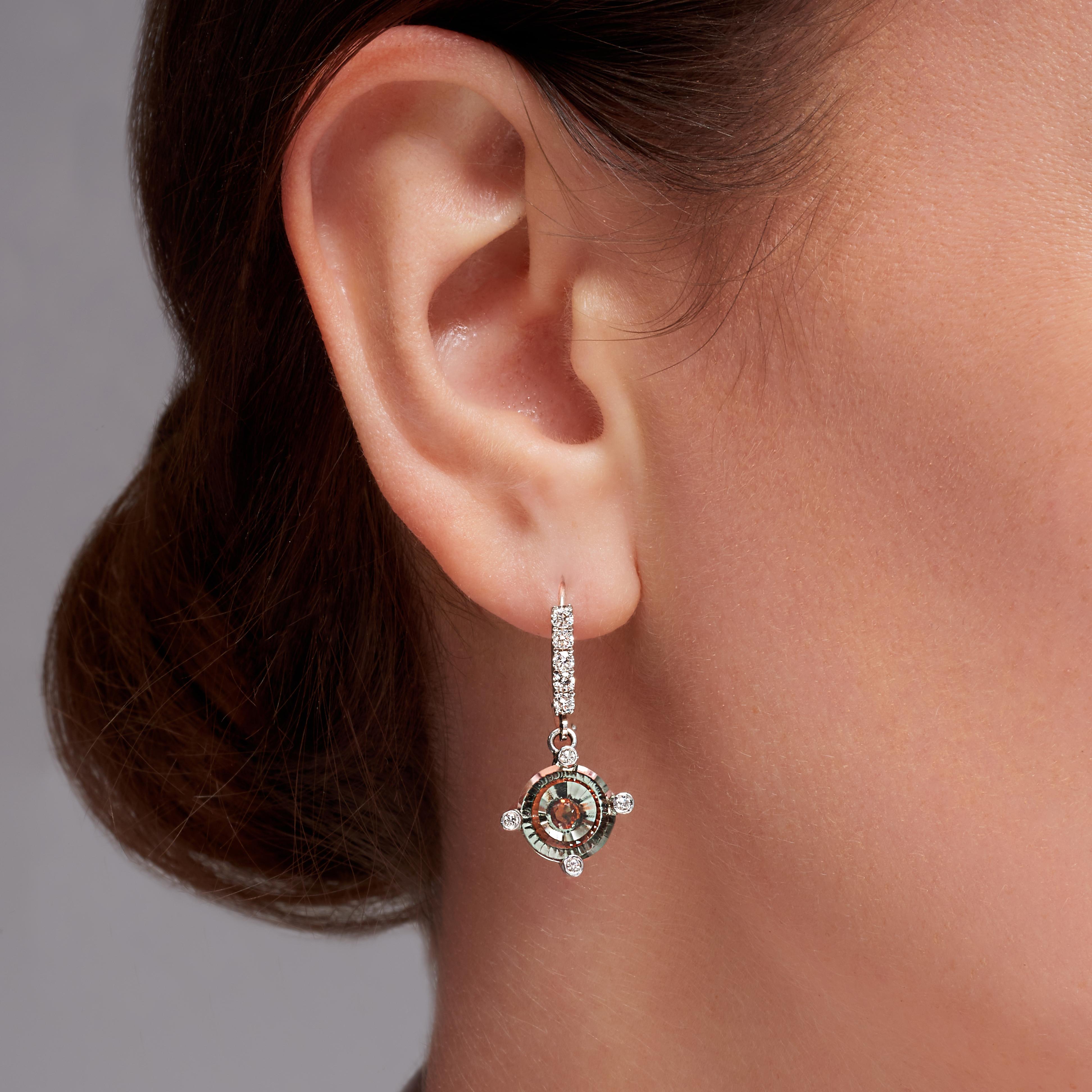 5 Carat Prasiolite Spessartite Garnet Diamond White Gold Drop Earrings. These 18-karat white gold drop earrings feature an 8-millimeter by 5-millimeter 5-carat total weight holographic cut prasiolite, cut by Darryl Alexander. This is an