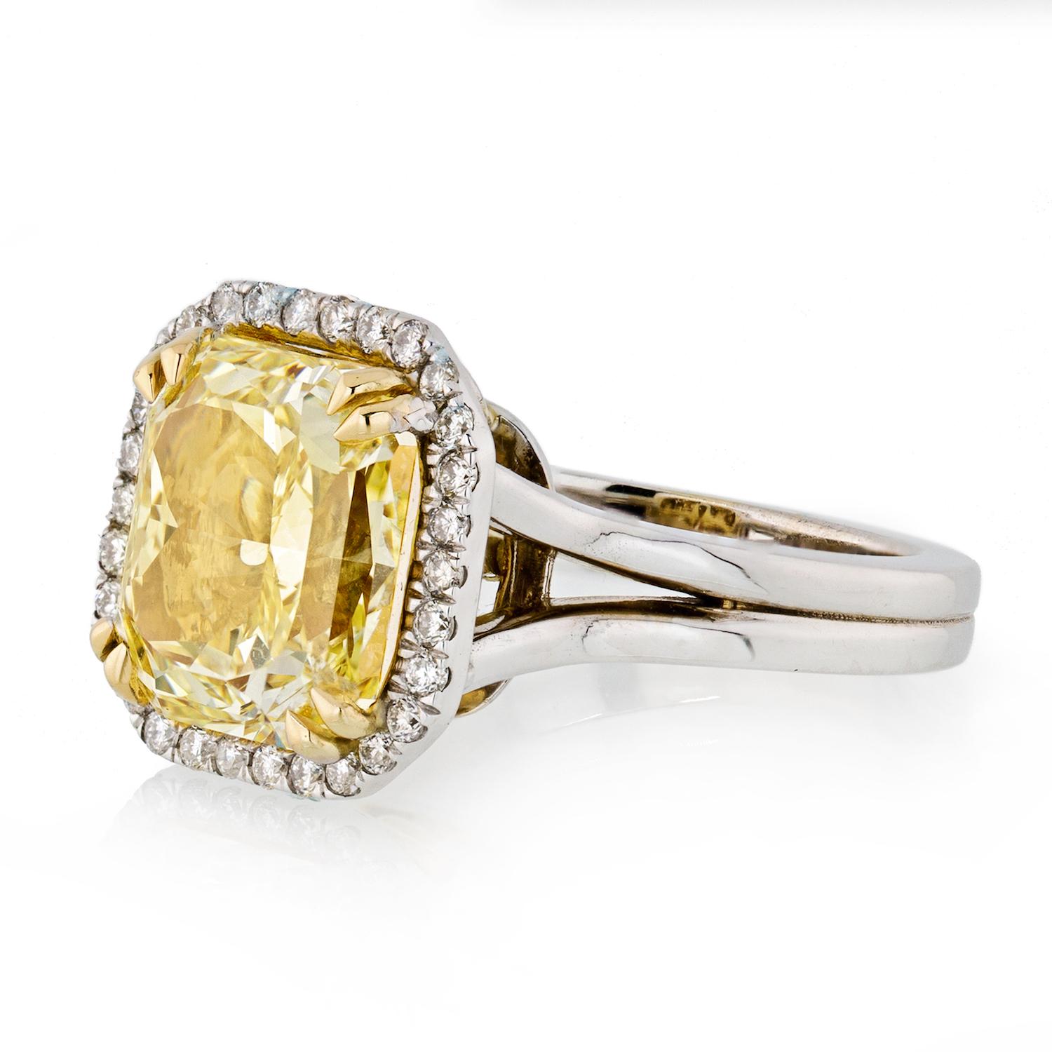 Stunning Fancy Yellow diamond ring crafted in platinum. You will be head over heels the moment you see this ring. Split shank ensures that this ring doesn't spin on your finger and the white pave diamonds serve as a sparkly backdrop. 

Elevated off