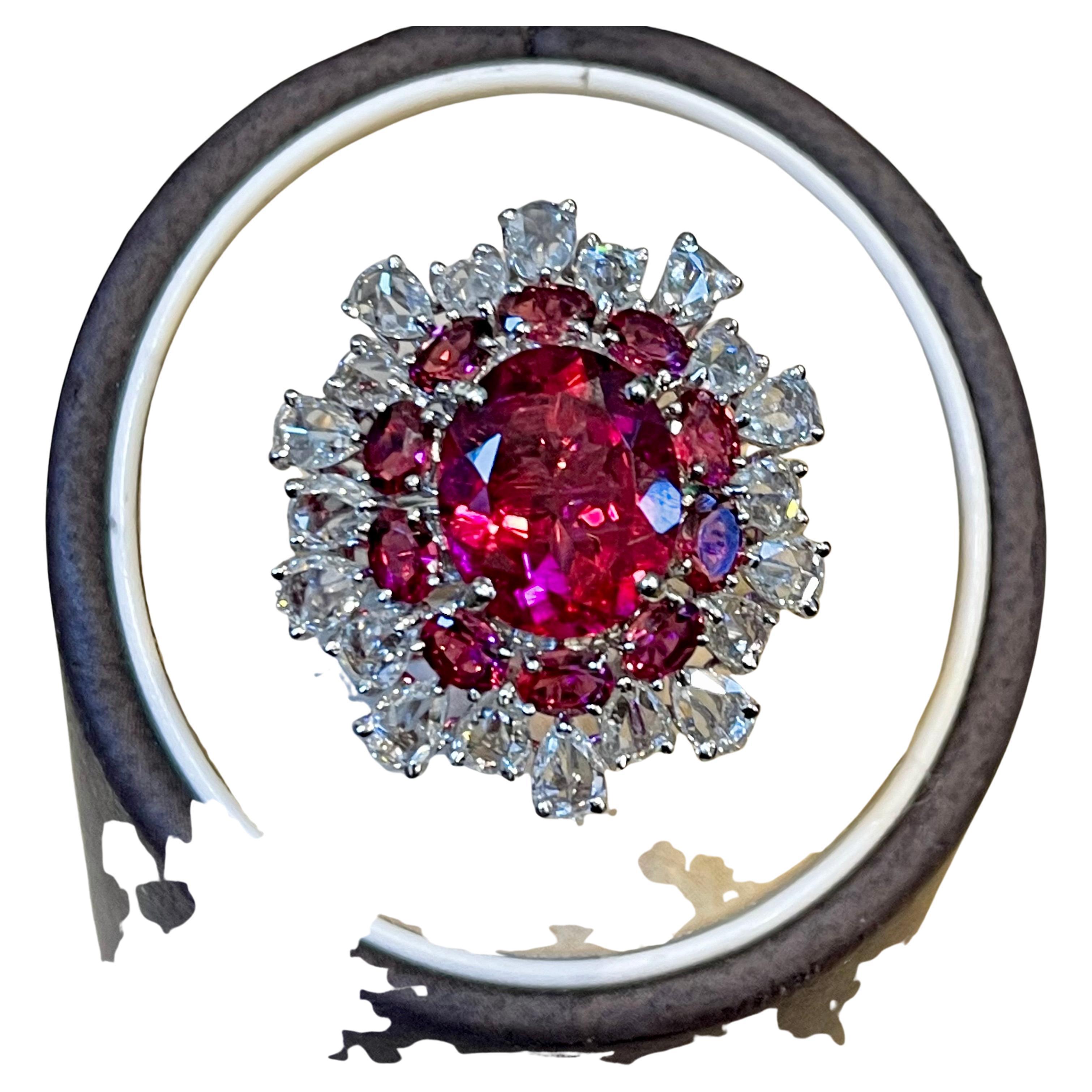 A classic, Cocktail ring 
5 Carat Rubelite and 4.5 Carat Diamond 18 Karat White  Gold Cocktail Ring Estate
Gold: 18 Karat White gold 
Weight: 7.76 gram
Size of the ring 6, It can be resized for free of charge.
Center oval shape Rubelite of high