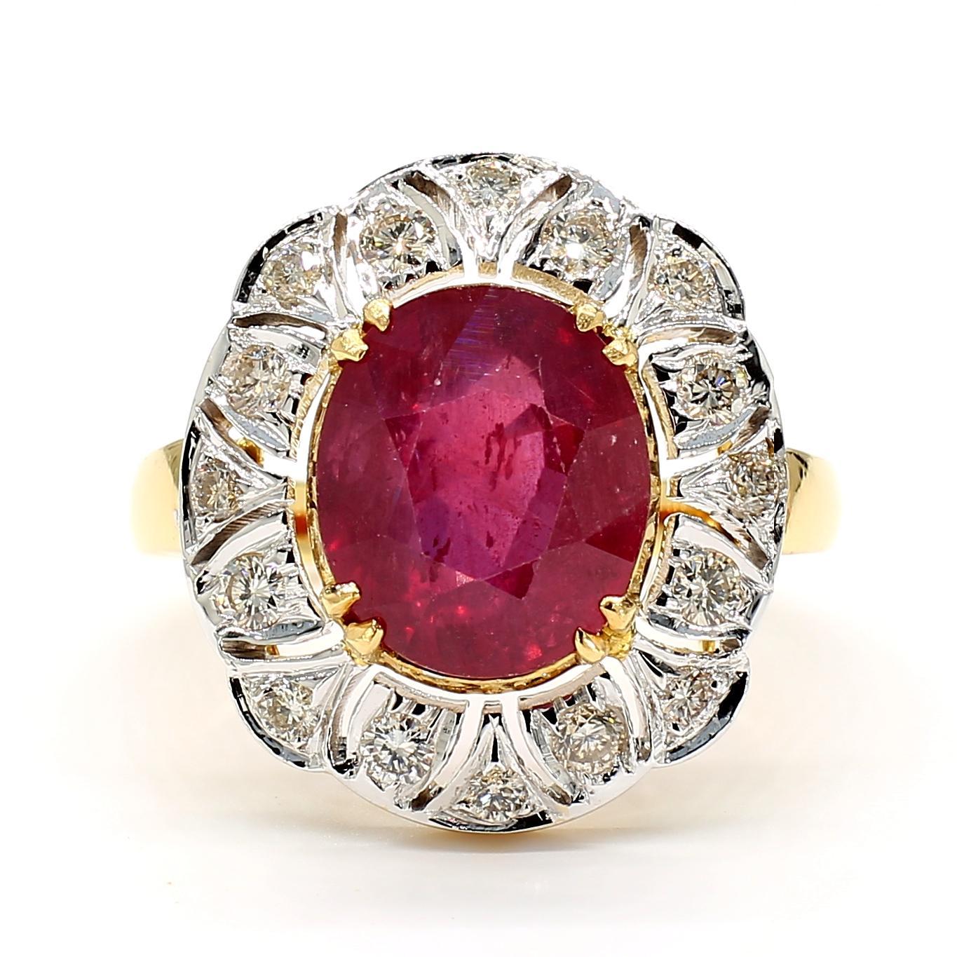 This striking ring features a 5.0 Carat Oval Ruby, radiating a deep red hue that captures attention. The ruby is encircled by a halo of round diamonds, totaling 0.4 Carats, each with a clarity of VS2 and a color grade of F, adding a brilliant