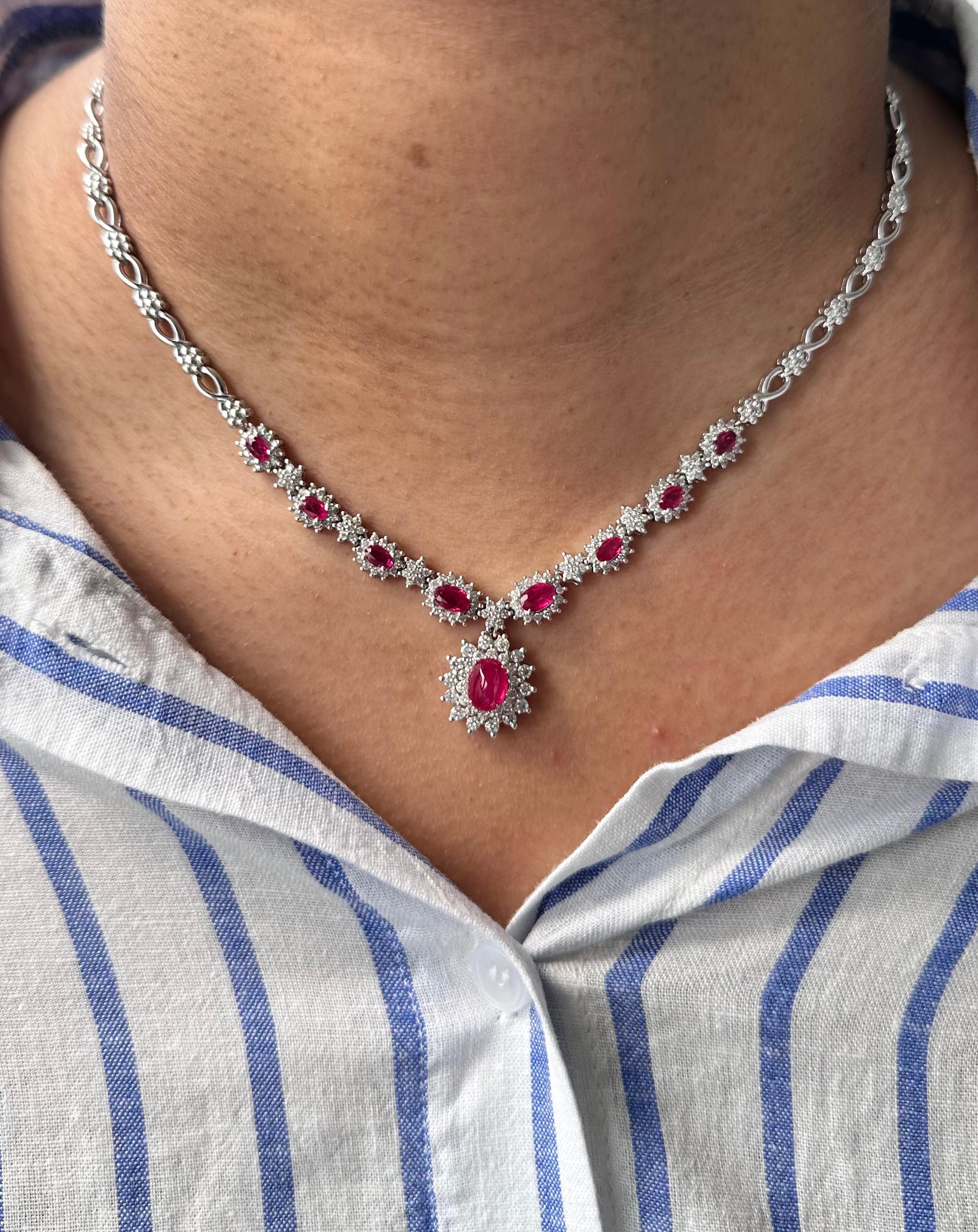 A graceful fusion of heritage and elegance, this extraordinary necklace showcases the allure of Burmese rubies and the brilliance of natural diamonds in a timeless floral design. Crafted in 27.92 grams of 14K white gold, the piece is both luxurious