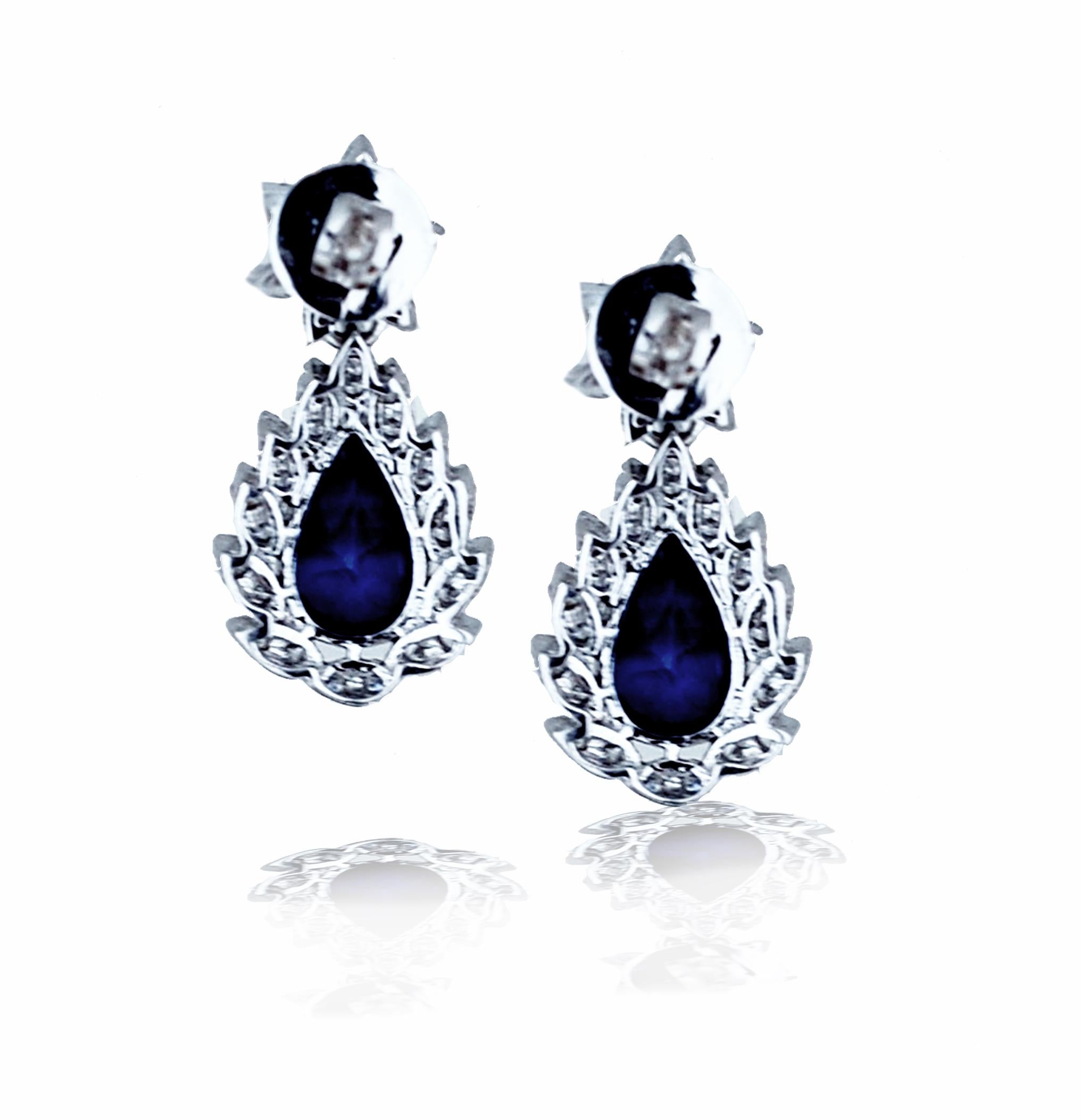 A pair of rich deep blue sapphire and diamond earrings can be appreciated by most.  This pair has a wonderful balance of deep blue sapphires contrasted with bright white diamonds.  The sapphires are mounted in a prong head setting and have diamond