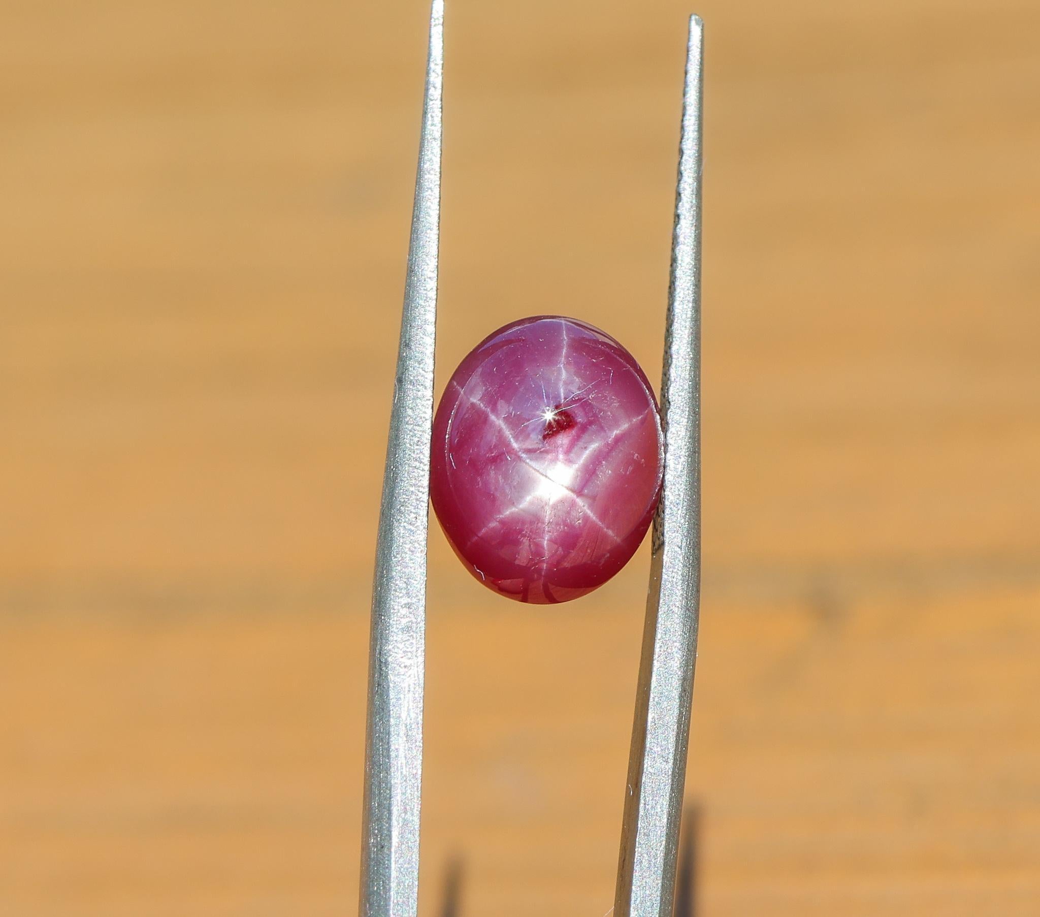 NNJ Designs presents a 5.02 carat oval Star Ruby loose gemstone! A Star Ruby is a type of gemstone that displays a six-rayed star when light is shone onto it. Star rubies are unique and mystical gemstones. This gemstone also makes a lovely July