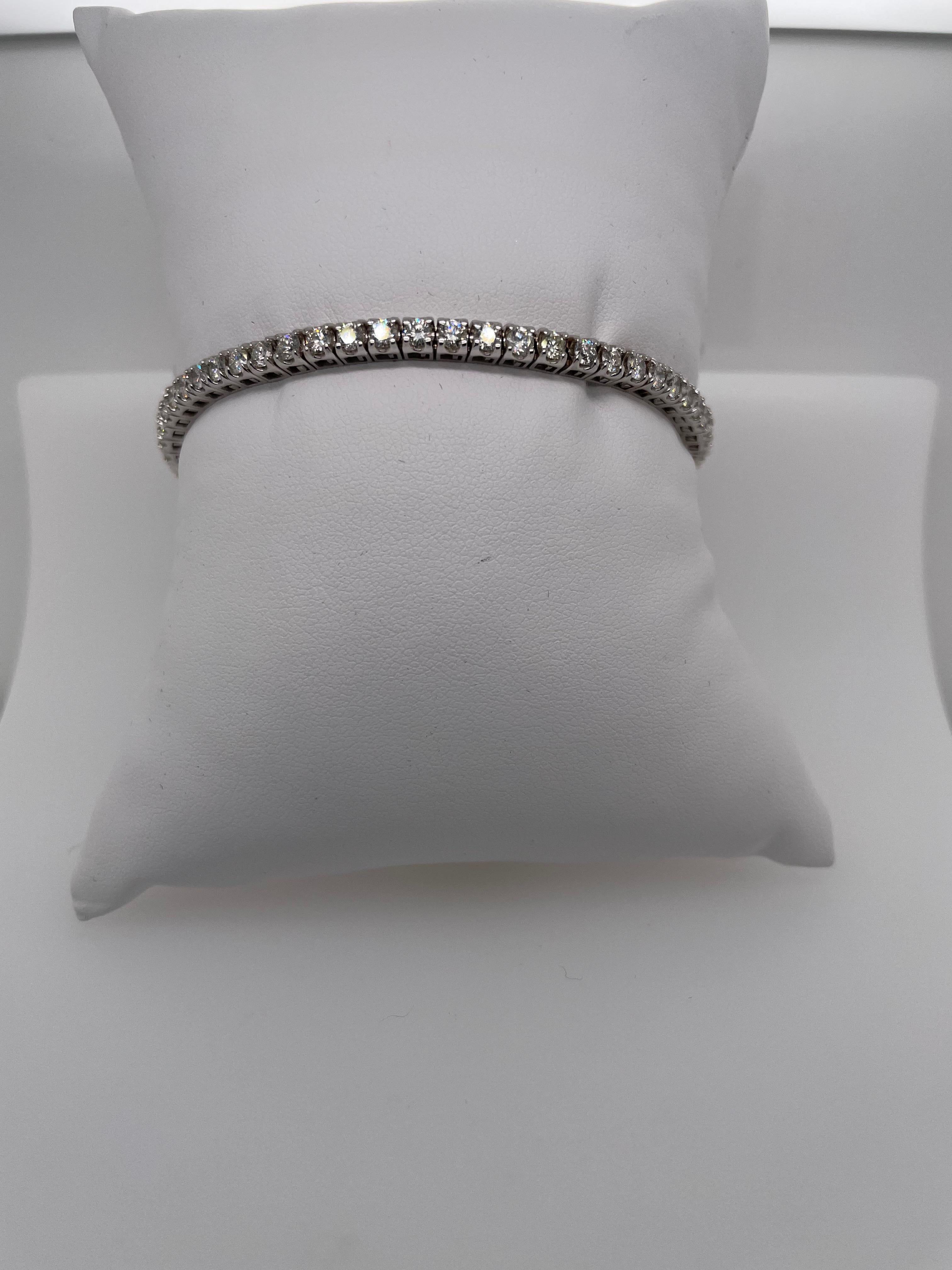 Classic and stunning stretch 5 carat total weight, white diamond tennis bracelet.  14K White Gold.  A classic piece to be worn daily alone or easily stacks beautifully with other bracelets.  A must for any wardrobe! 
