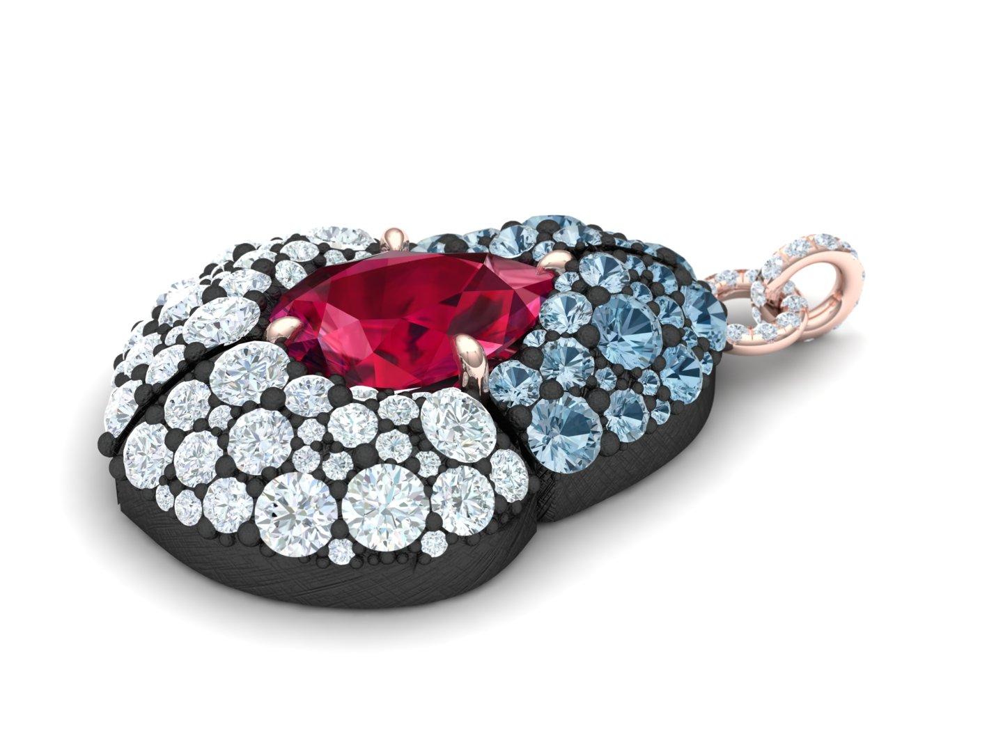 This modern twist on a classic pairs two of our favorite metals grey silver and rose gold.  The pendant is hand pierced and has a pastel gradient of light blue sapphires into white F-G VS-SI round brilliant diamonds.  This pendant is designed with