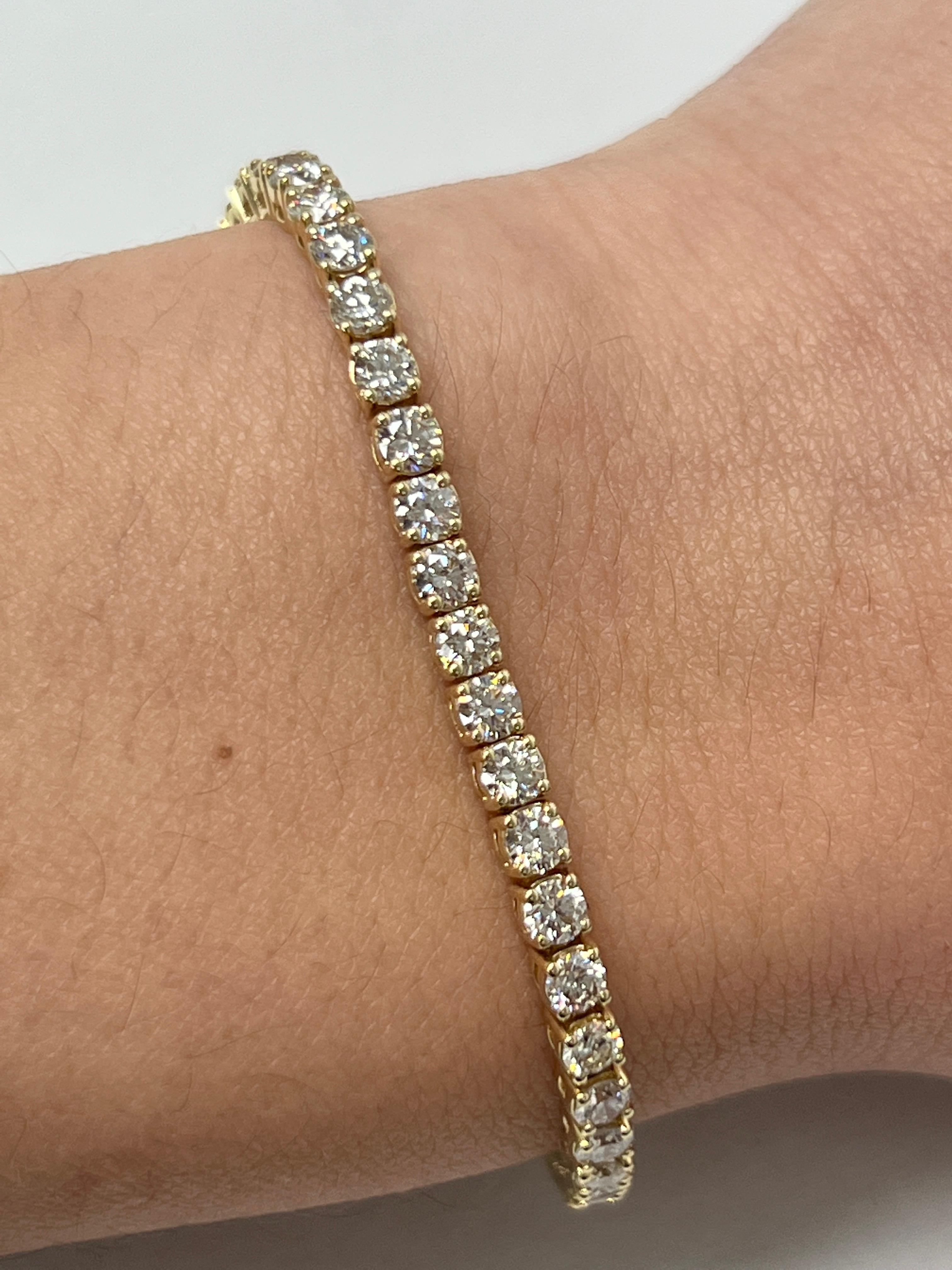 Fashion and glam are at the forefront with this exquisite diamond bracelet. This 14-karat yellow gold diamond bracelet is made from 11.4 grams of gold. The top is adorned with one row of I-J color, VS/SI clarity diamonds. This bracelet carries 54